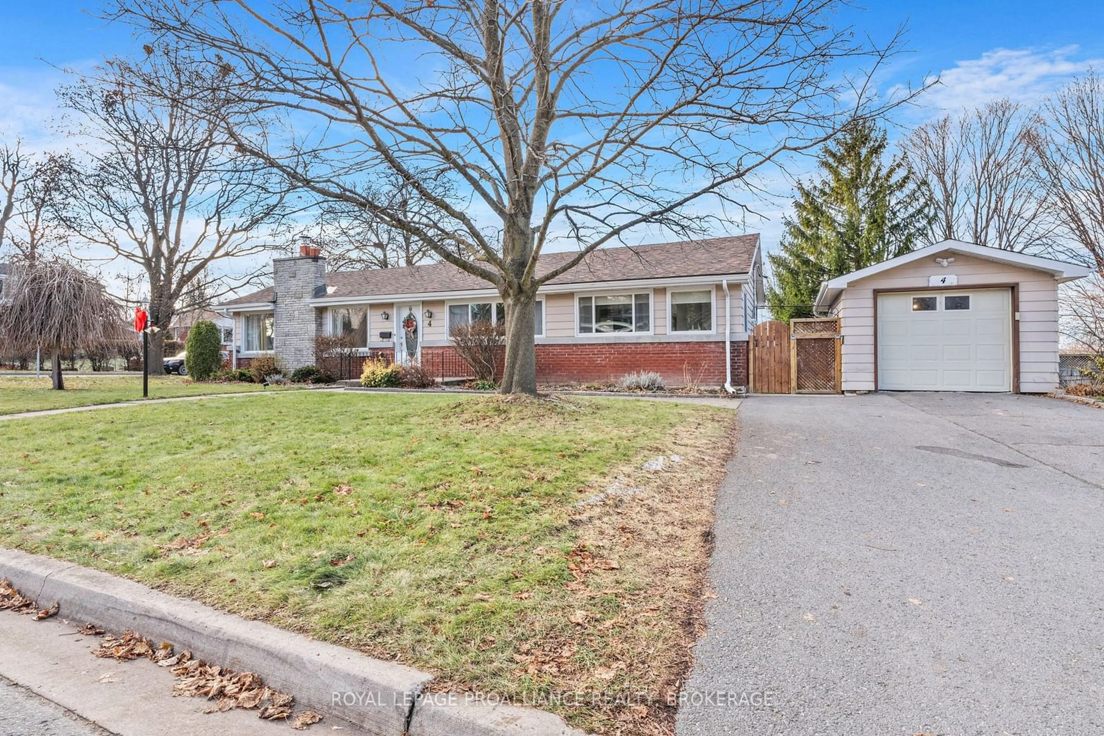 Frontside or backside of a home, the fenced backyard for 4 Strathcona Cres, Kingston Ontario K7M 1N8