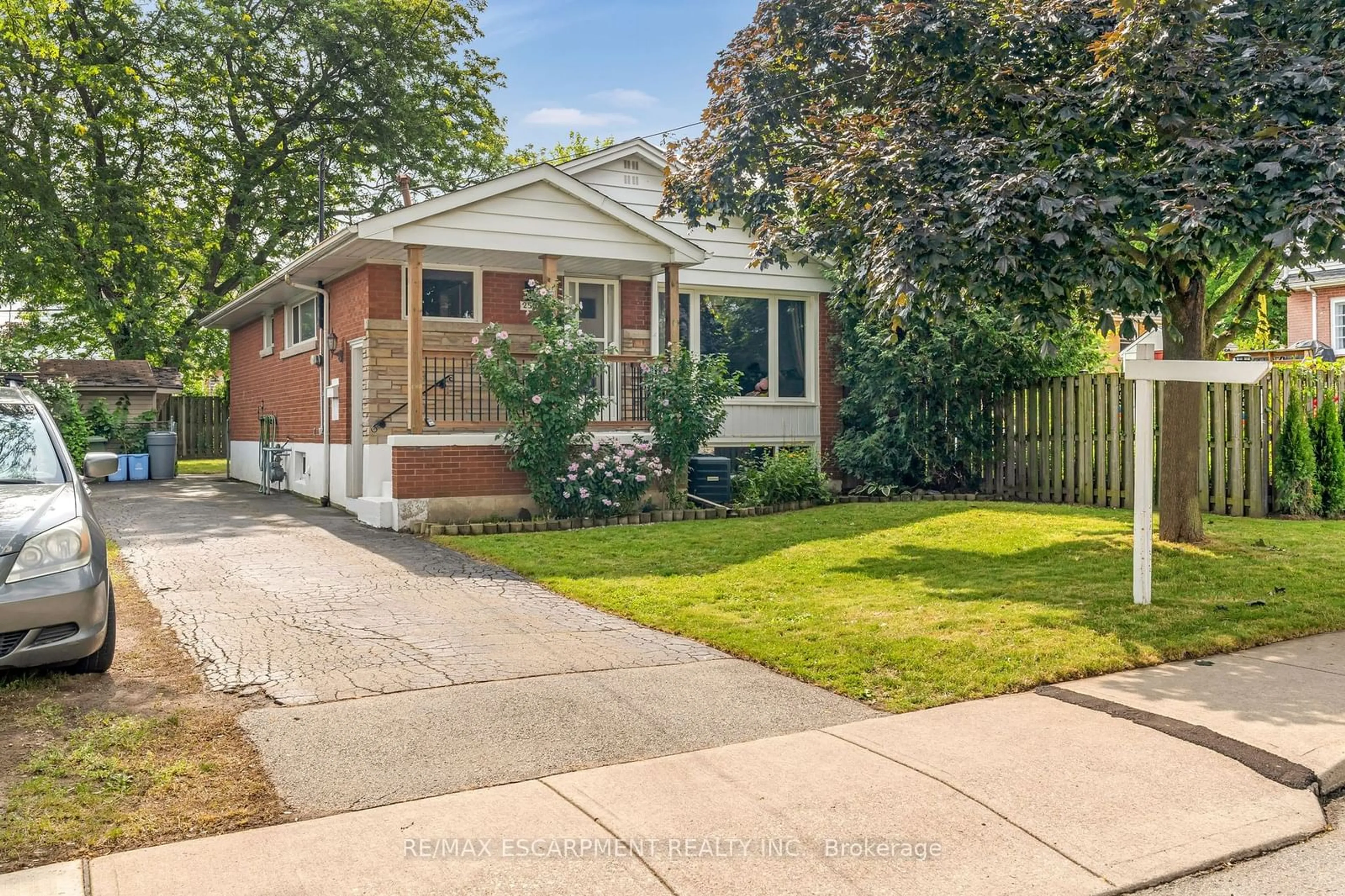 Frontside or backside of a home, the fenced backyard for 253 West 33rd St, Hamilton Ontario L9C 5J7