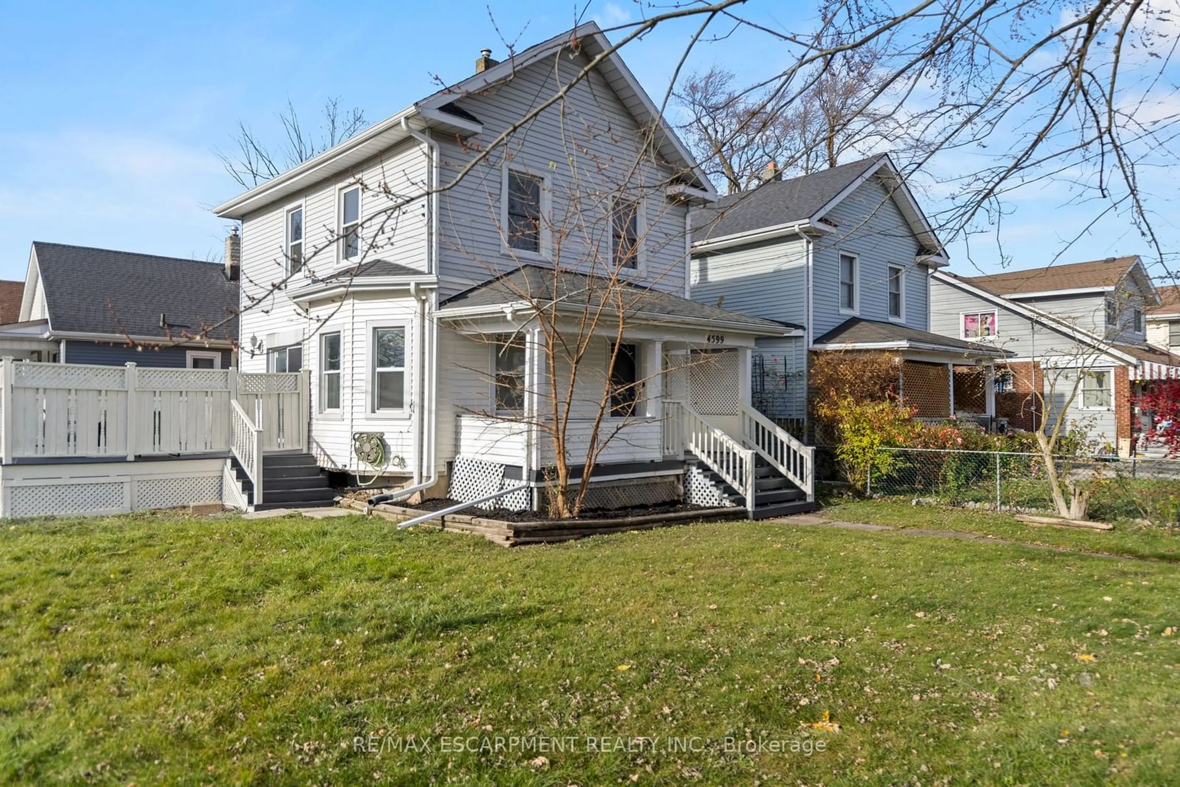 Frontside or backside of a home, the fenced backyard for 4599 Fourth Ave, Niagara Falls Ontario L2E 4N5