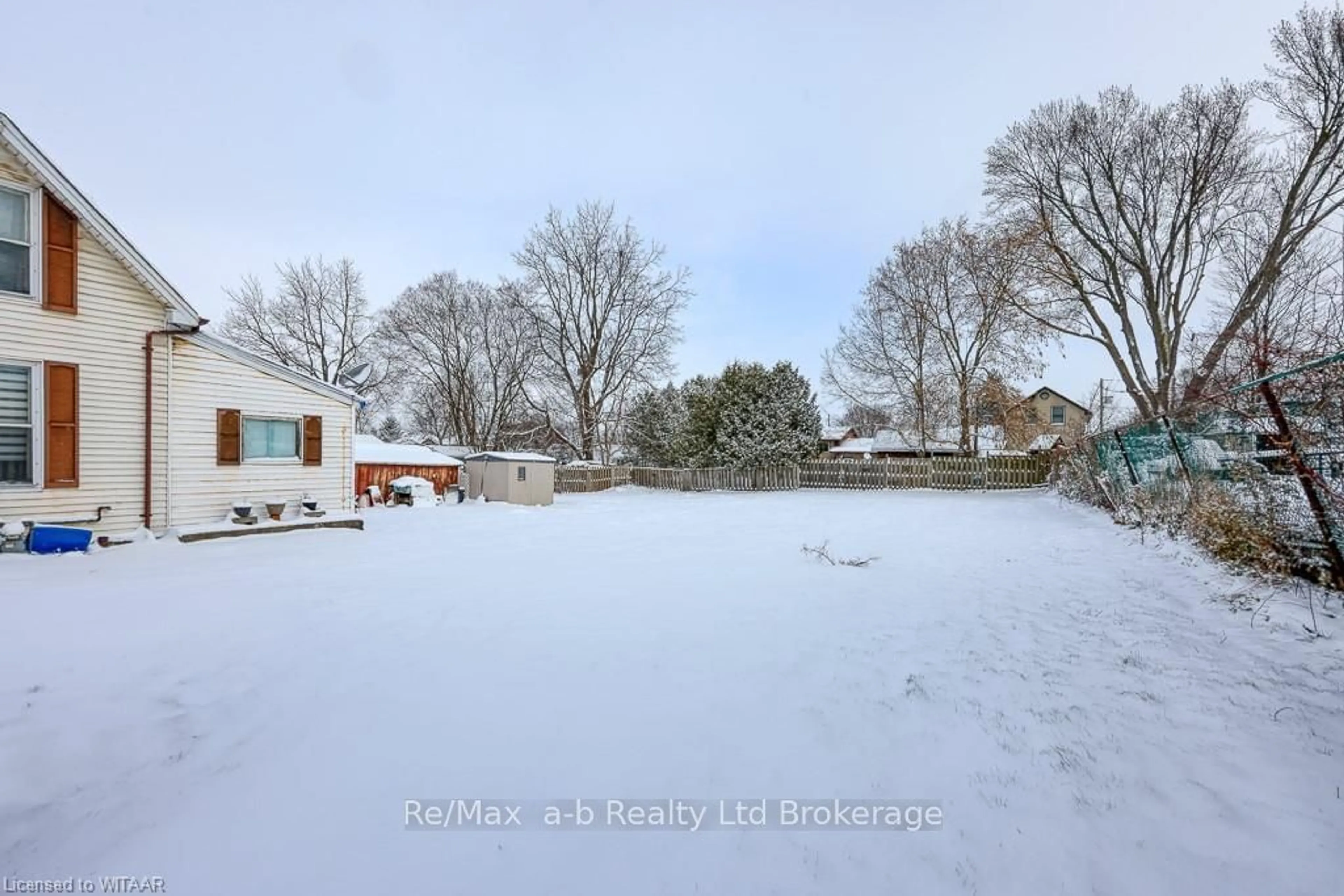 A pic from exterior of the house or condo, the fenced backyard for 125 WHITING St, Ingersoll Ontario N5C 3B2