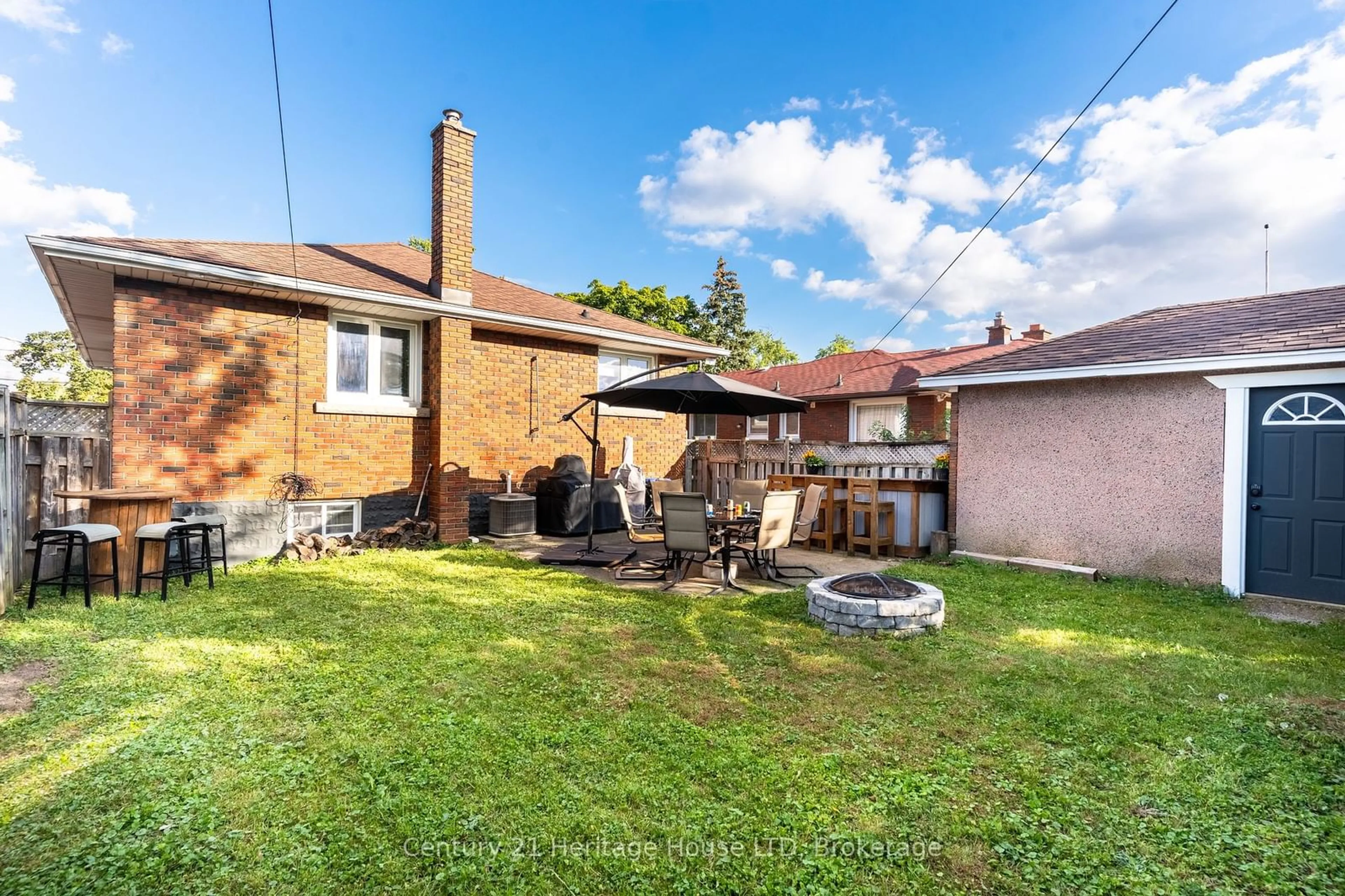 Frontside or backside of a home, the fenced backyard for 163 CAMROSE Ave, Welland Ontario L3B 1K4