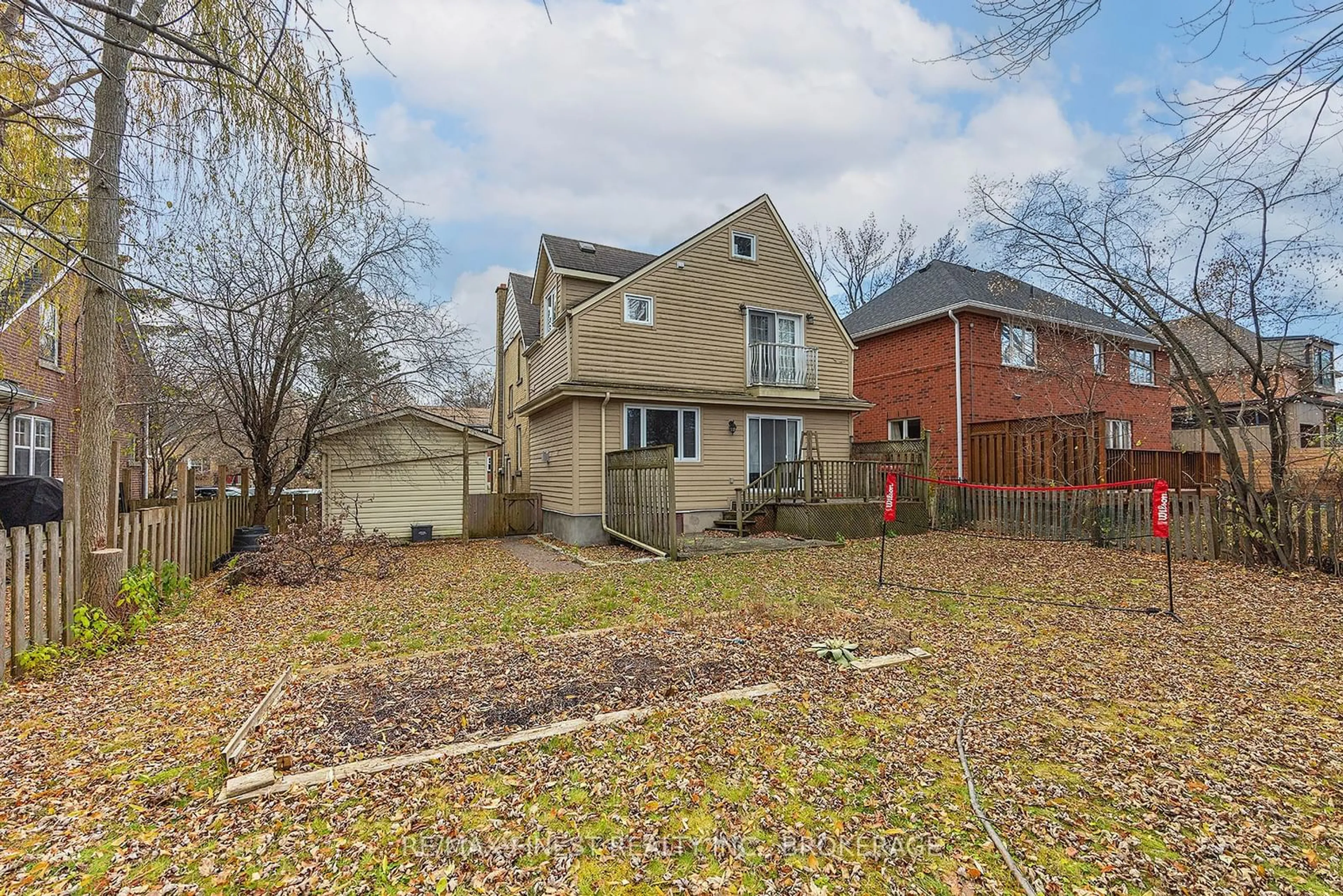 Frontside or backside of a home, the fenced backyard for 63 Hill St, Kingston Ontario K7L 2M6