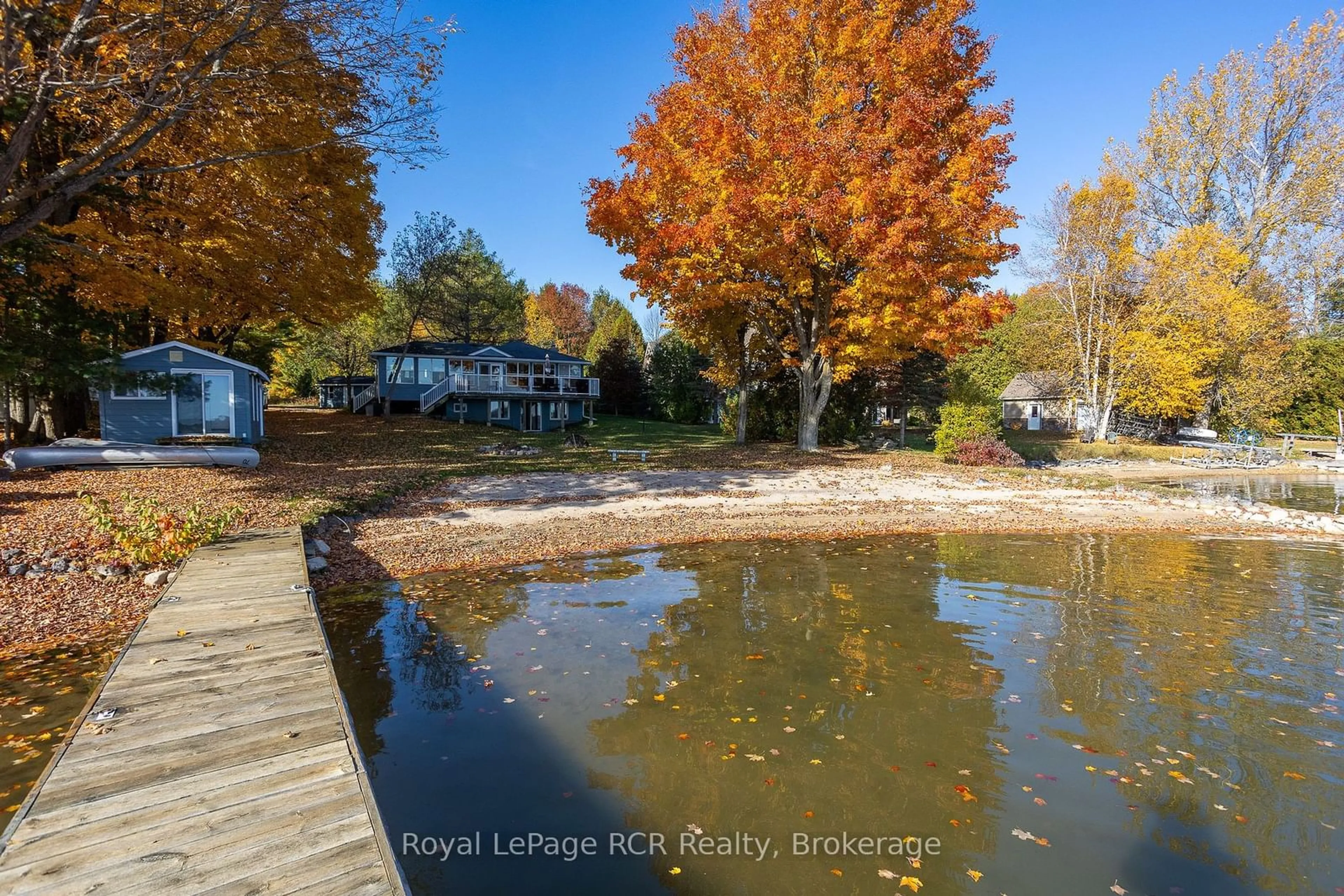 A pic from exterior of the house or condo, the fenced backyard for 211 Point Rd, Grey Highlands Ontario N0C 1E0