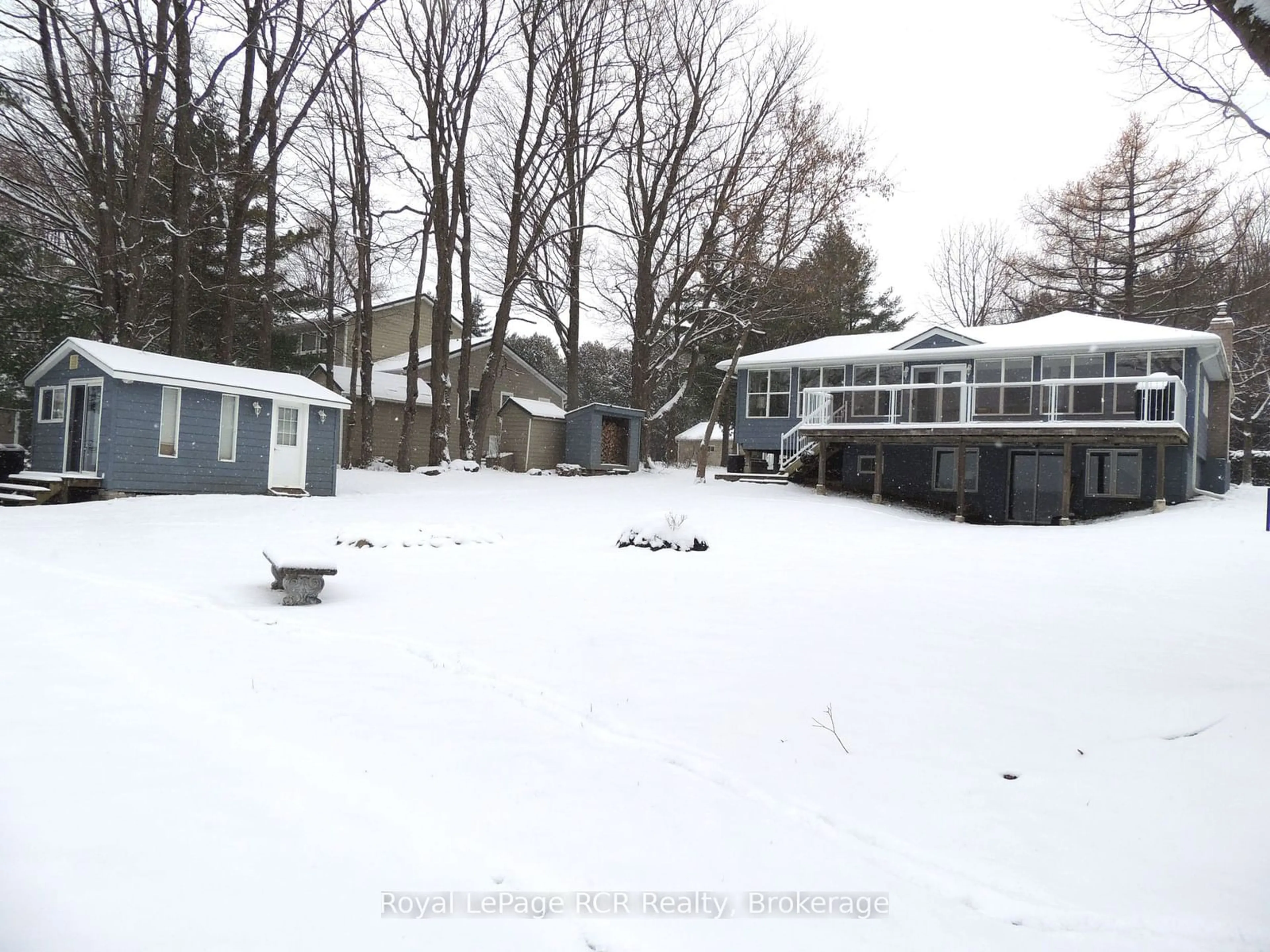 Frontside or backside of a home, the fenced backyard for 211 Point Rd, Grey Highlands Ontario N0C 1E0