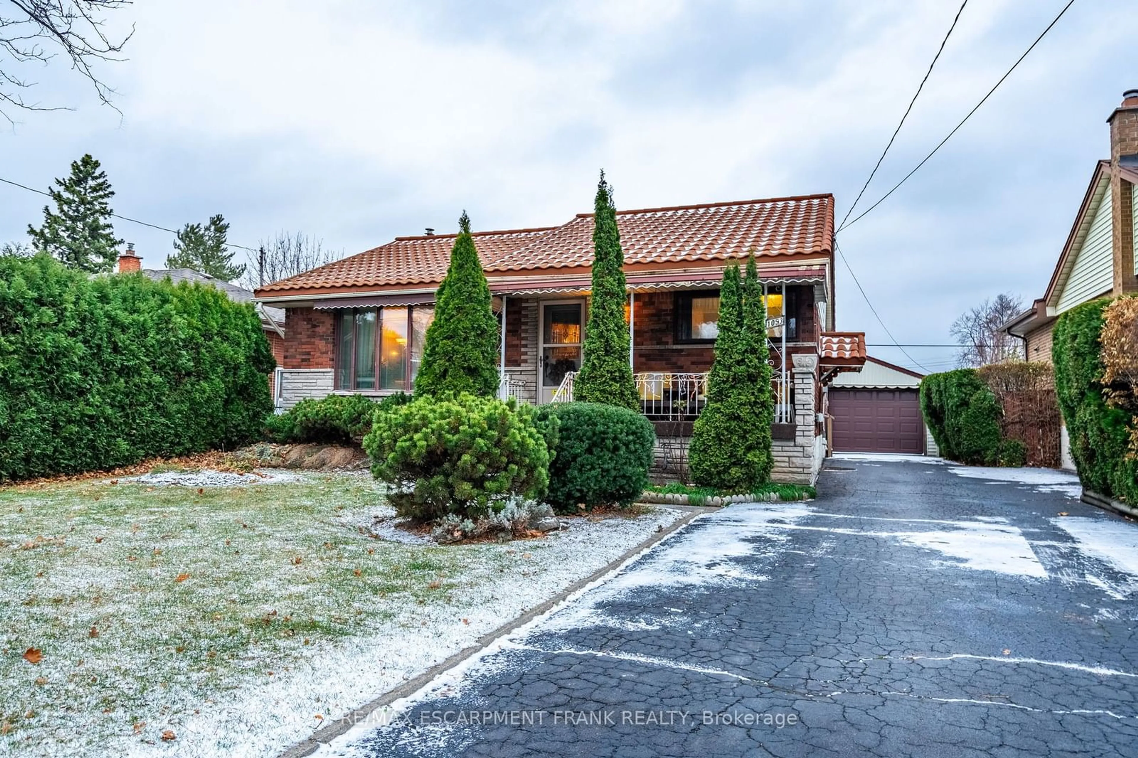 Frontside or backside of a home, the street view for 1053 Fennell Ave, Hamilton Ontario L8T 1R7