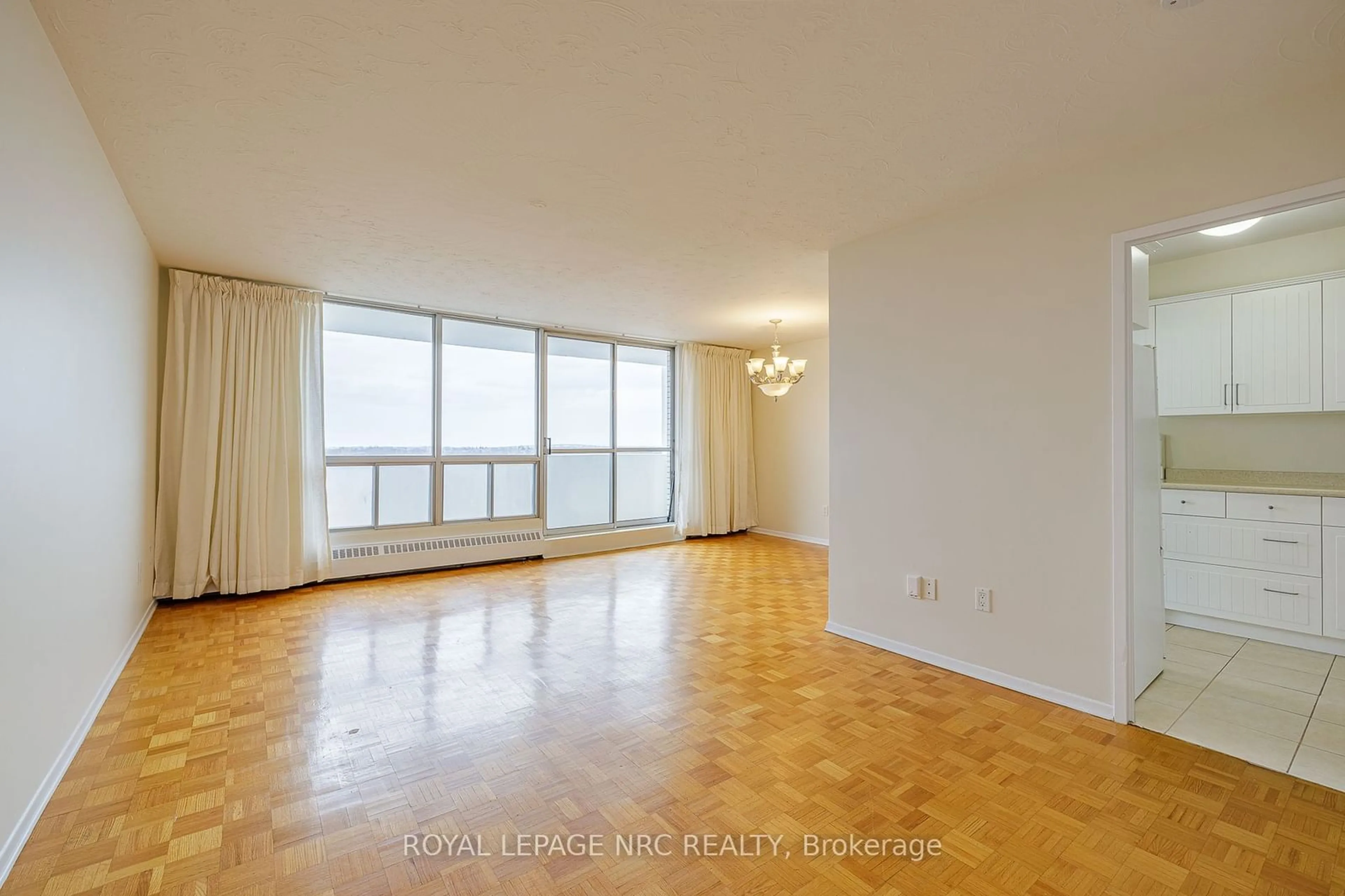 A pic of a room, wood floors for 15 TOWERING HEIGHTS Blvd #1006, St. Catharines Ontario L2T 3G7