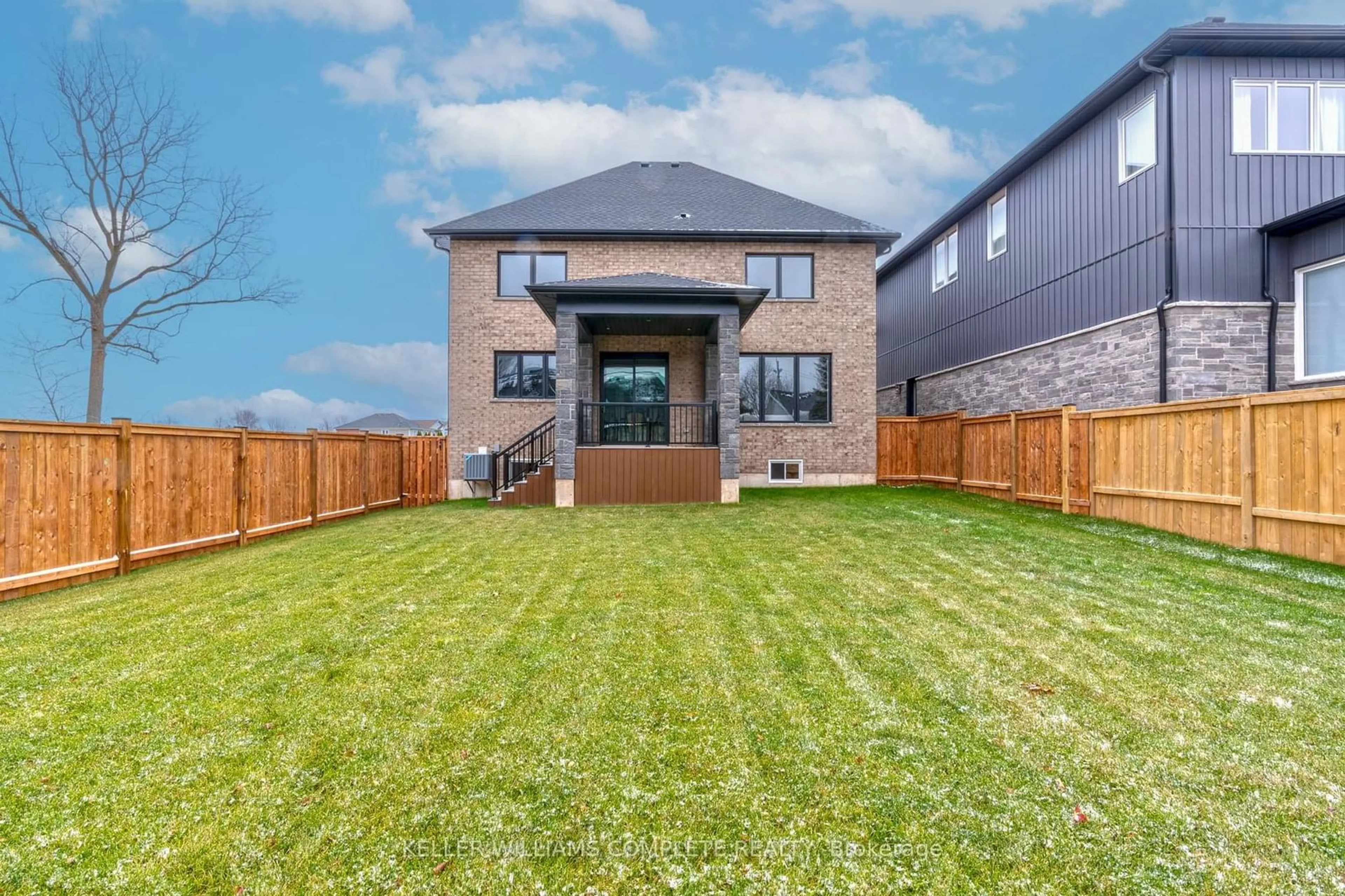 Frontside or backside of a home, the fenced backyard for 7 Bartlett Ave, Grimsby Ontario L3M 5N7