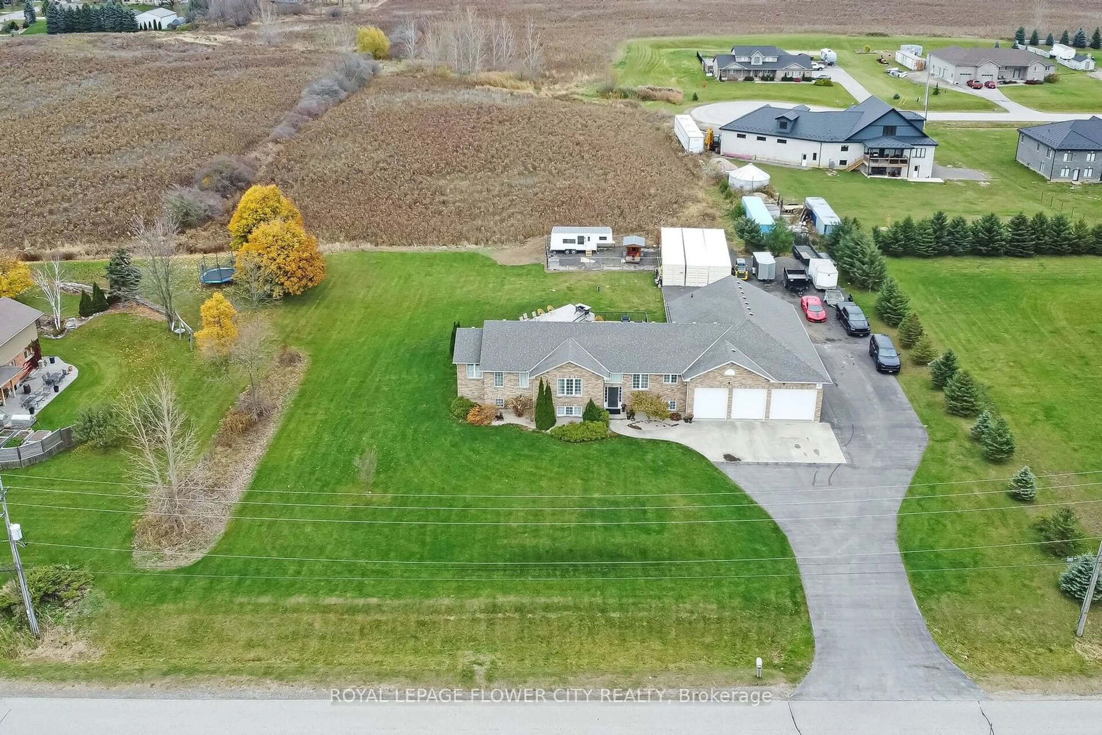 Frontside or backside of a home, the fenced backyard for 14 Stardust Dr, Thames Centre Ontario N0L 1G5