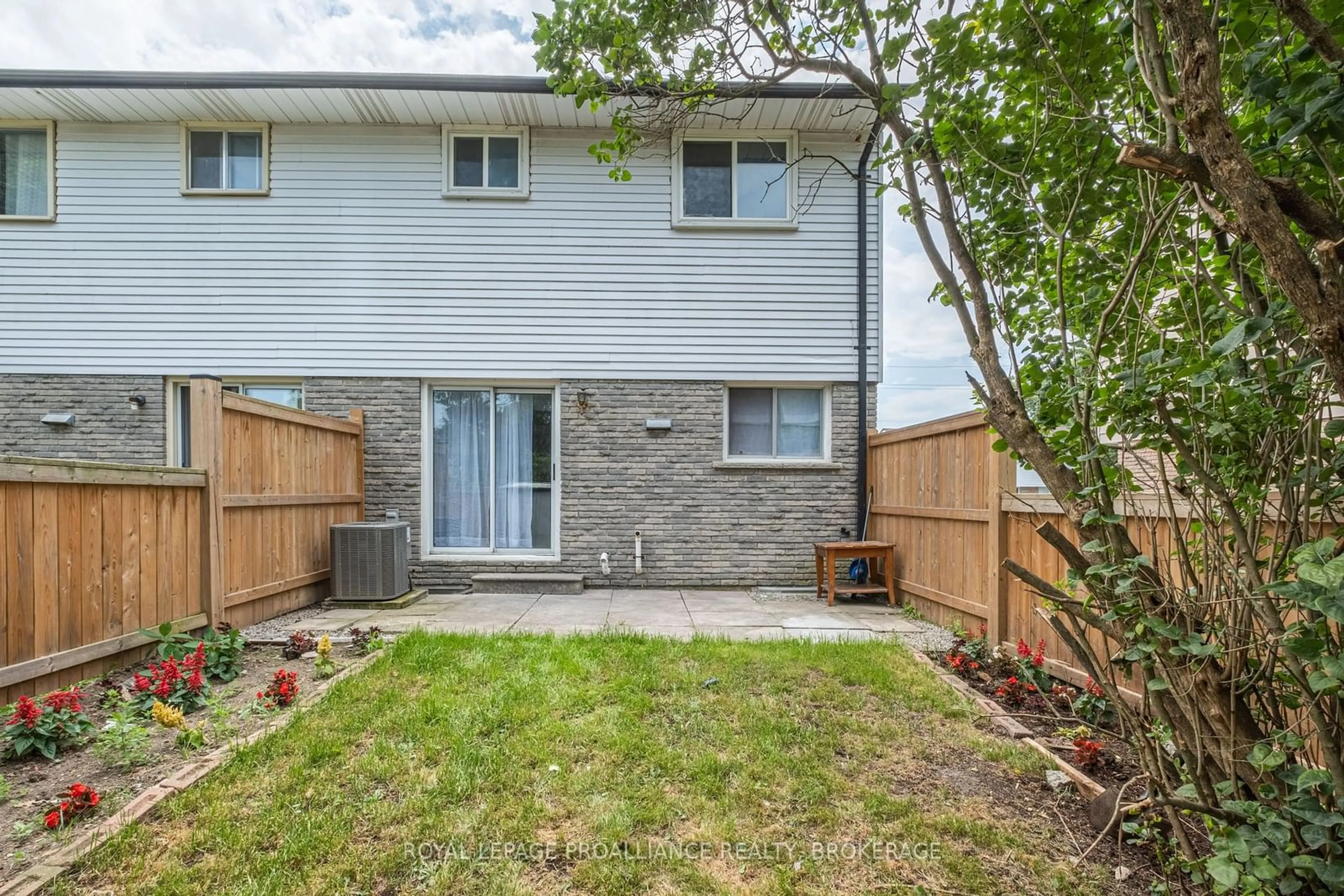 A pic from exterior of the house or condo, the fenced backyard for 930 Oakview Ave #134, Kingston Ontario K7M 6V6