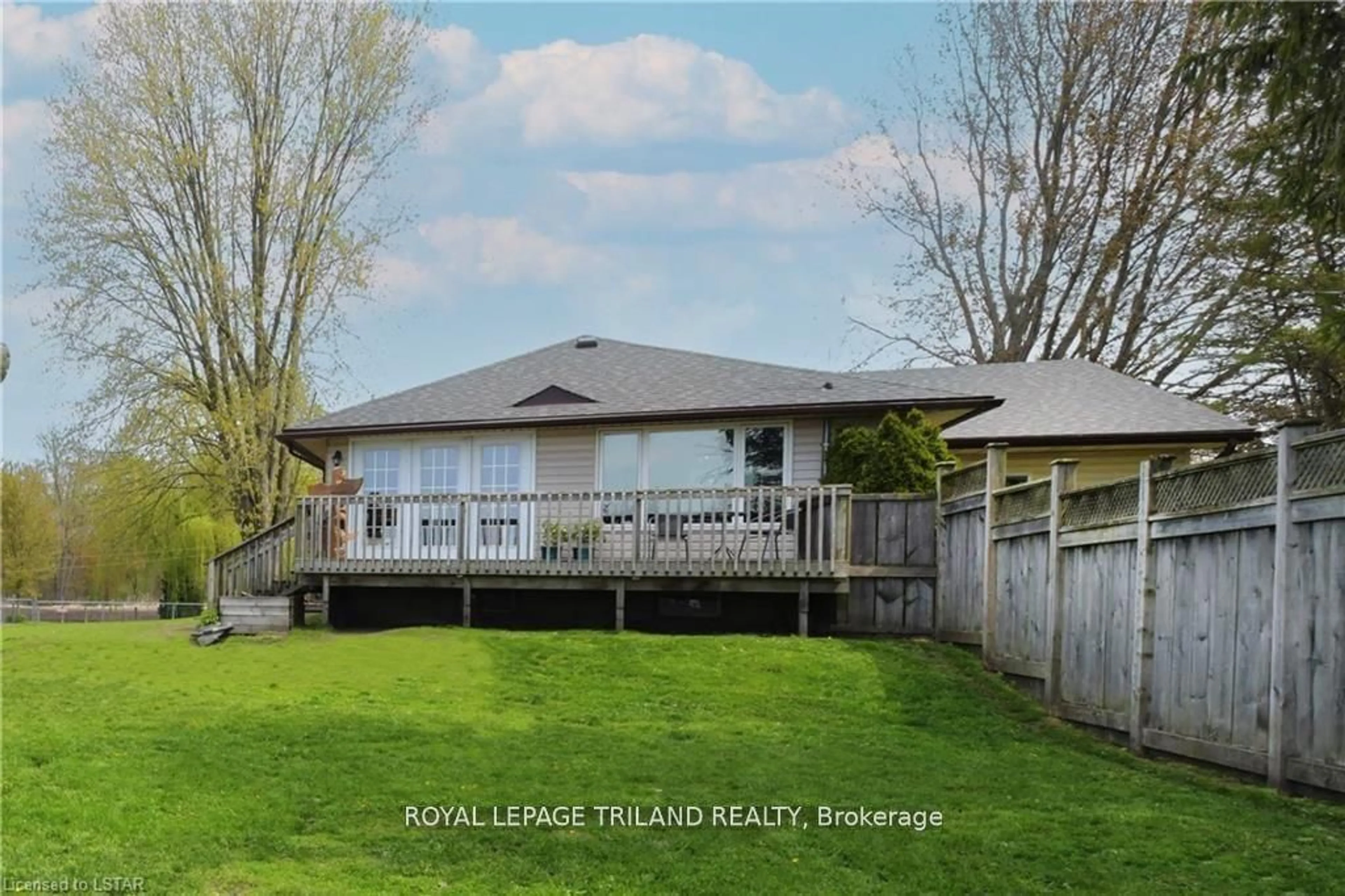 Frontside or backside of a home, the fenced backyard for 9078 Century Dr, Strathroy-Caradoc Ontario N0L 1W0