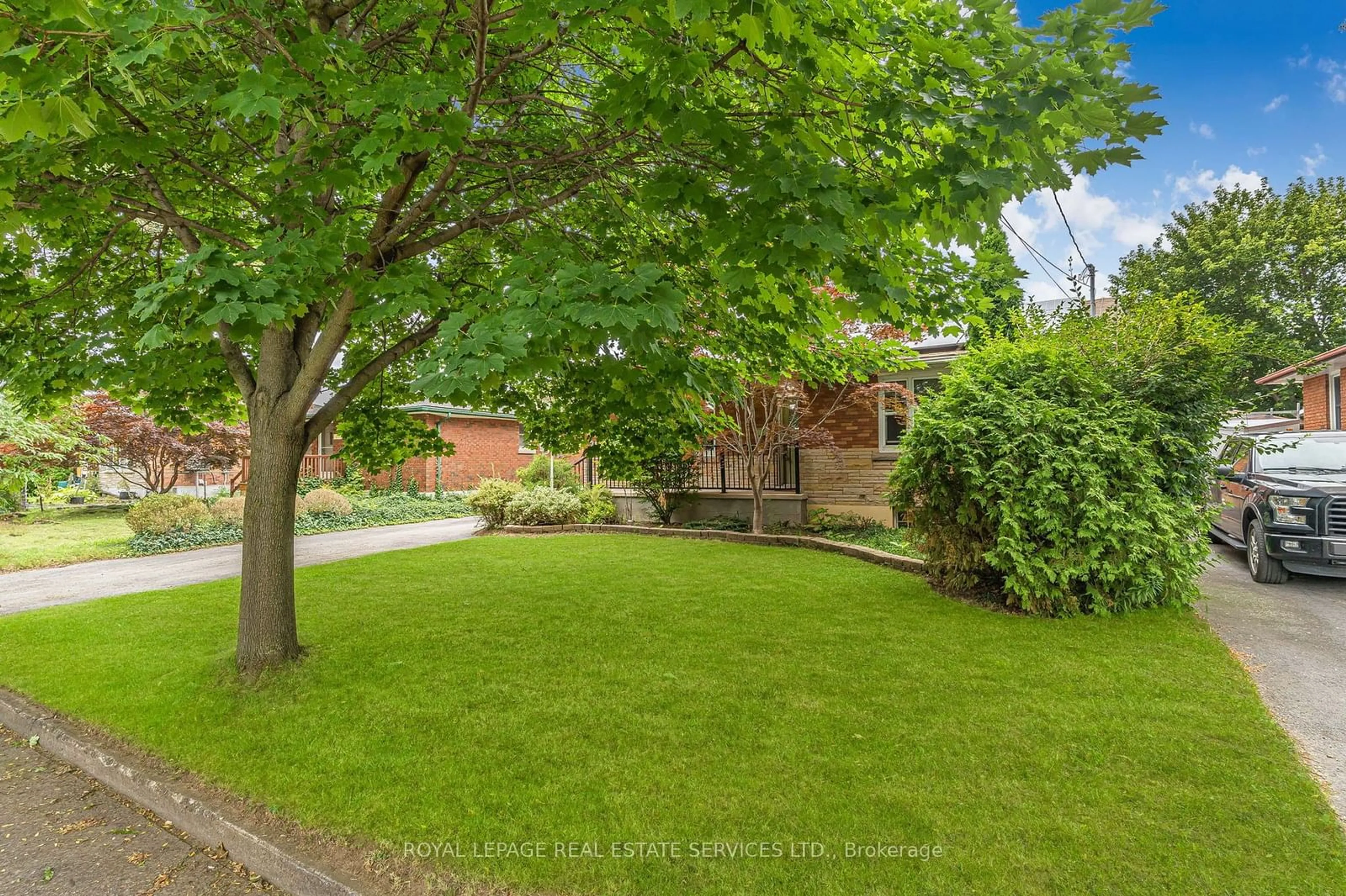 Frontside or backside of a home, the fenced backyard for 21 Chalmers St, St. Catharines Ontario L2M 5C7