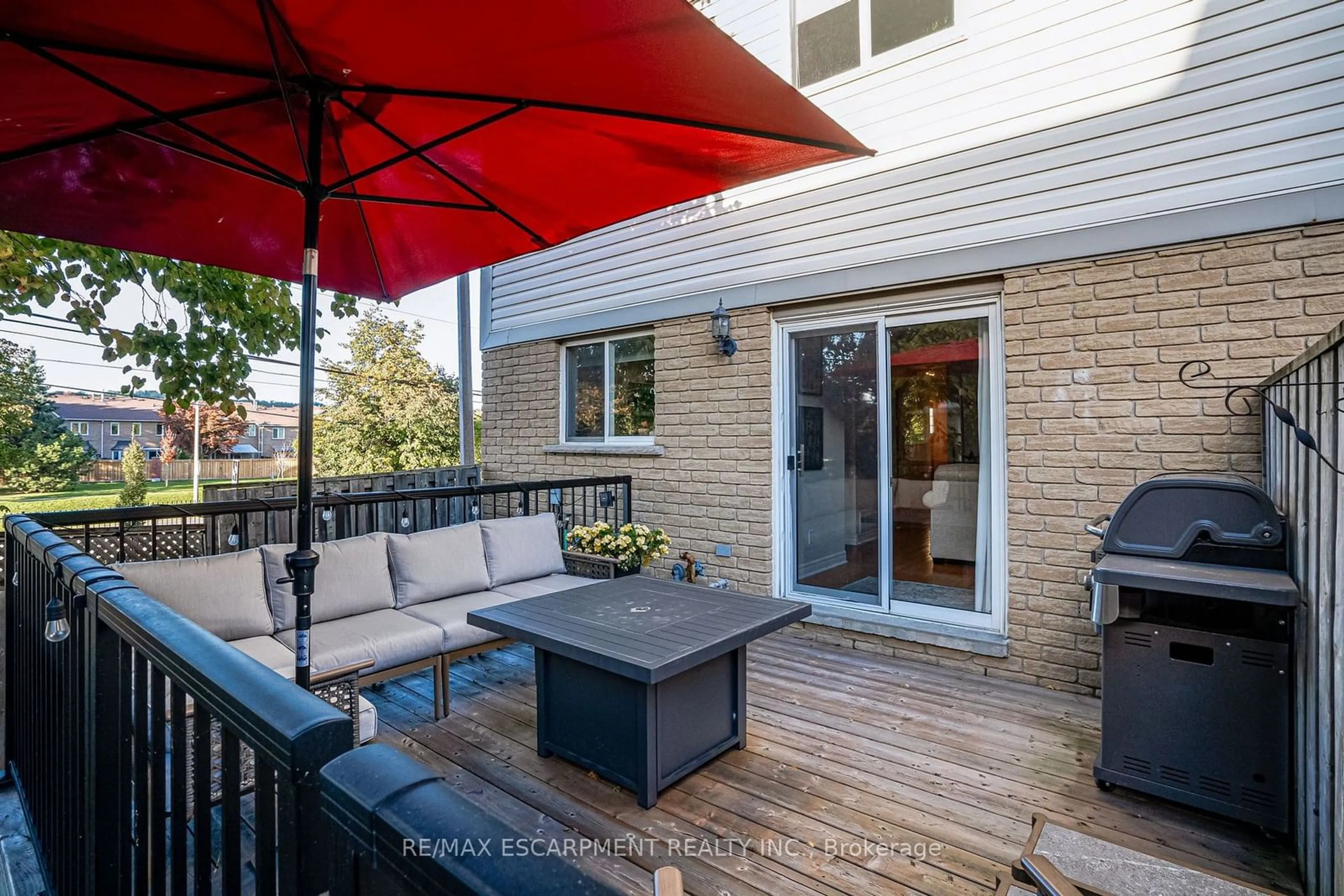 Patio, the fenced backyard for 31 Moss Blvd #17, Hamilton Ontario L9H 7A6