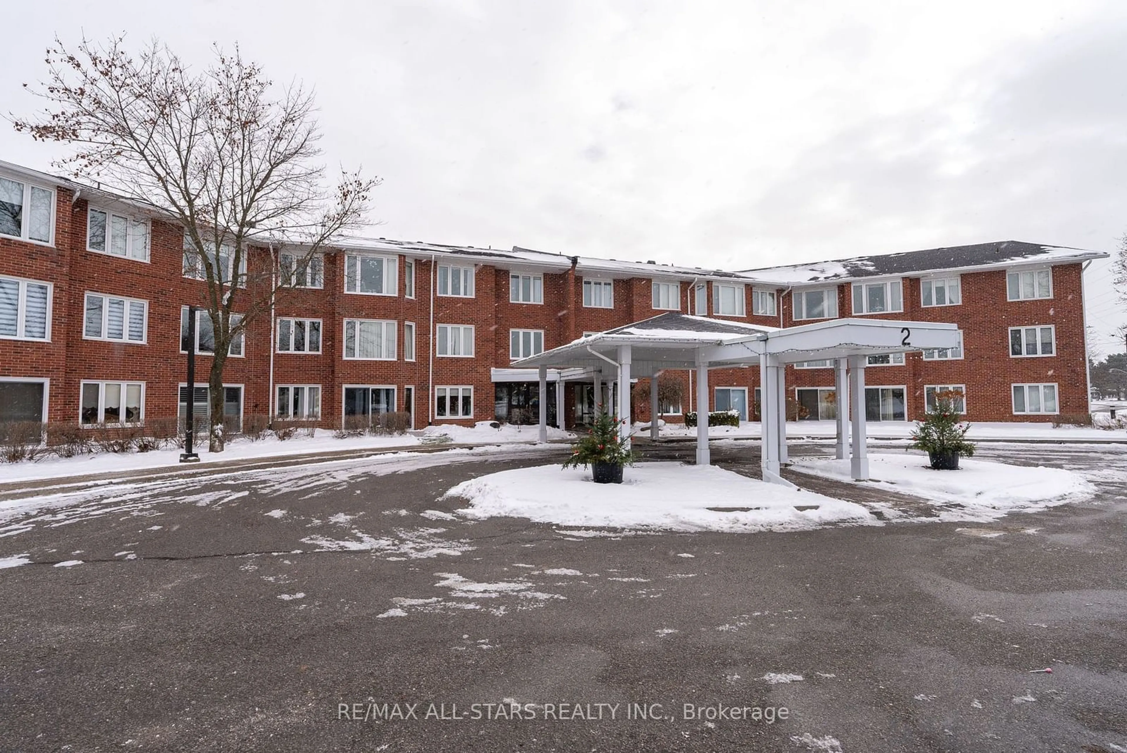 A pic from exterior of the house or condo, the front or back of building for 2 Heritage Way #208, Kawartha Lakes Ontario K9V 5P5