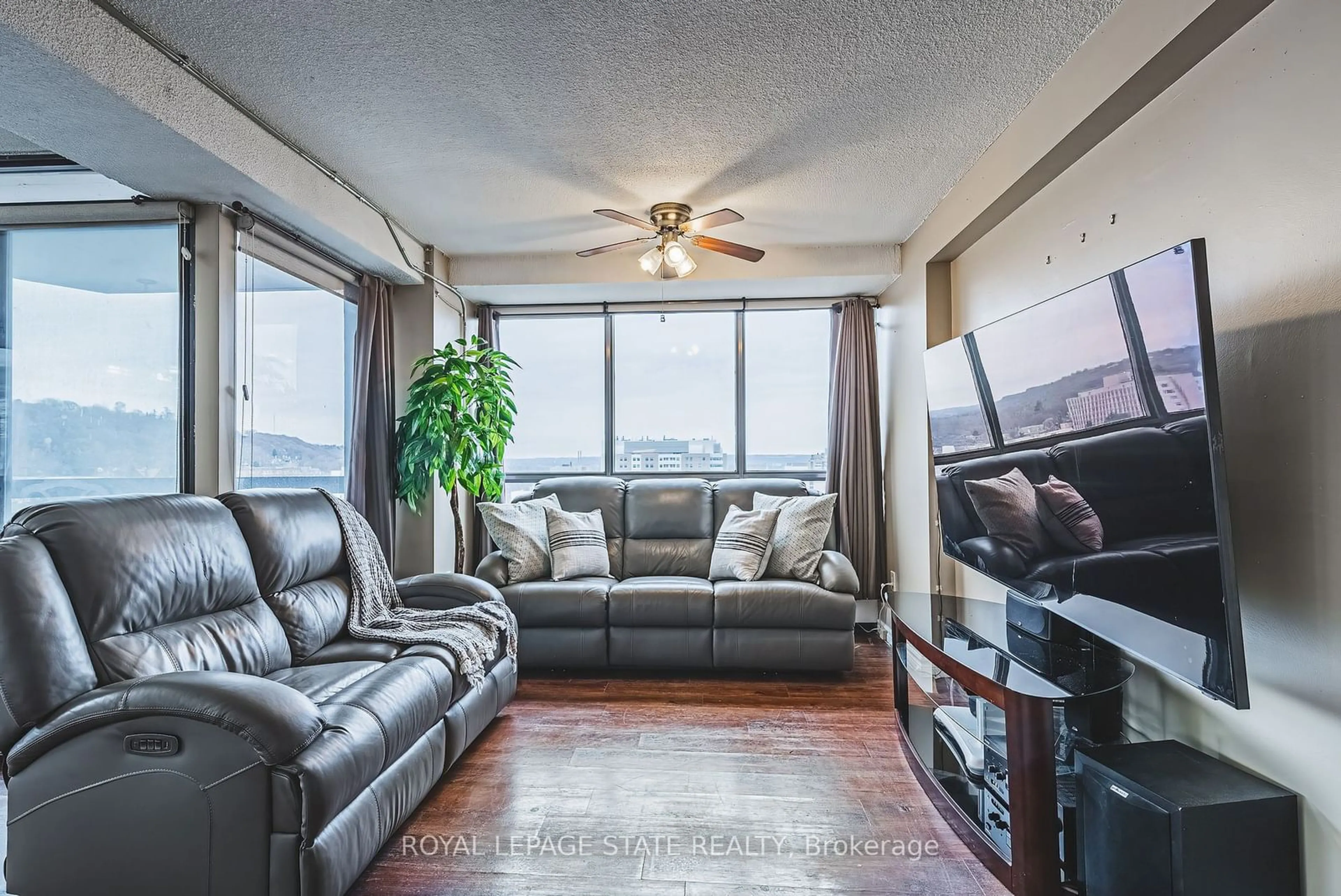 Living room, wood floors for 150 Charlton Ave #1908, Hamilton Ontario L8N 3X3