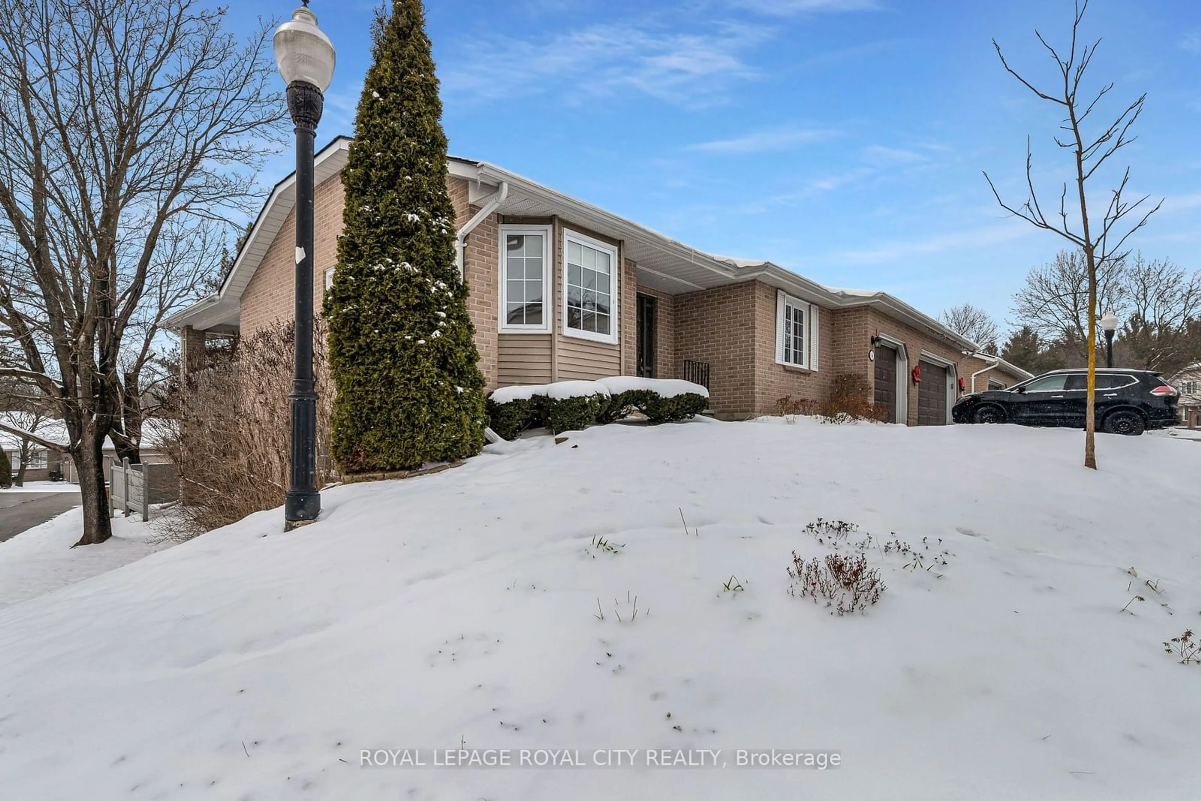 Frontside or backside of a home, the street view for 96 Woodlawn Rd #1, Guelph Ontario N1E 1B7