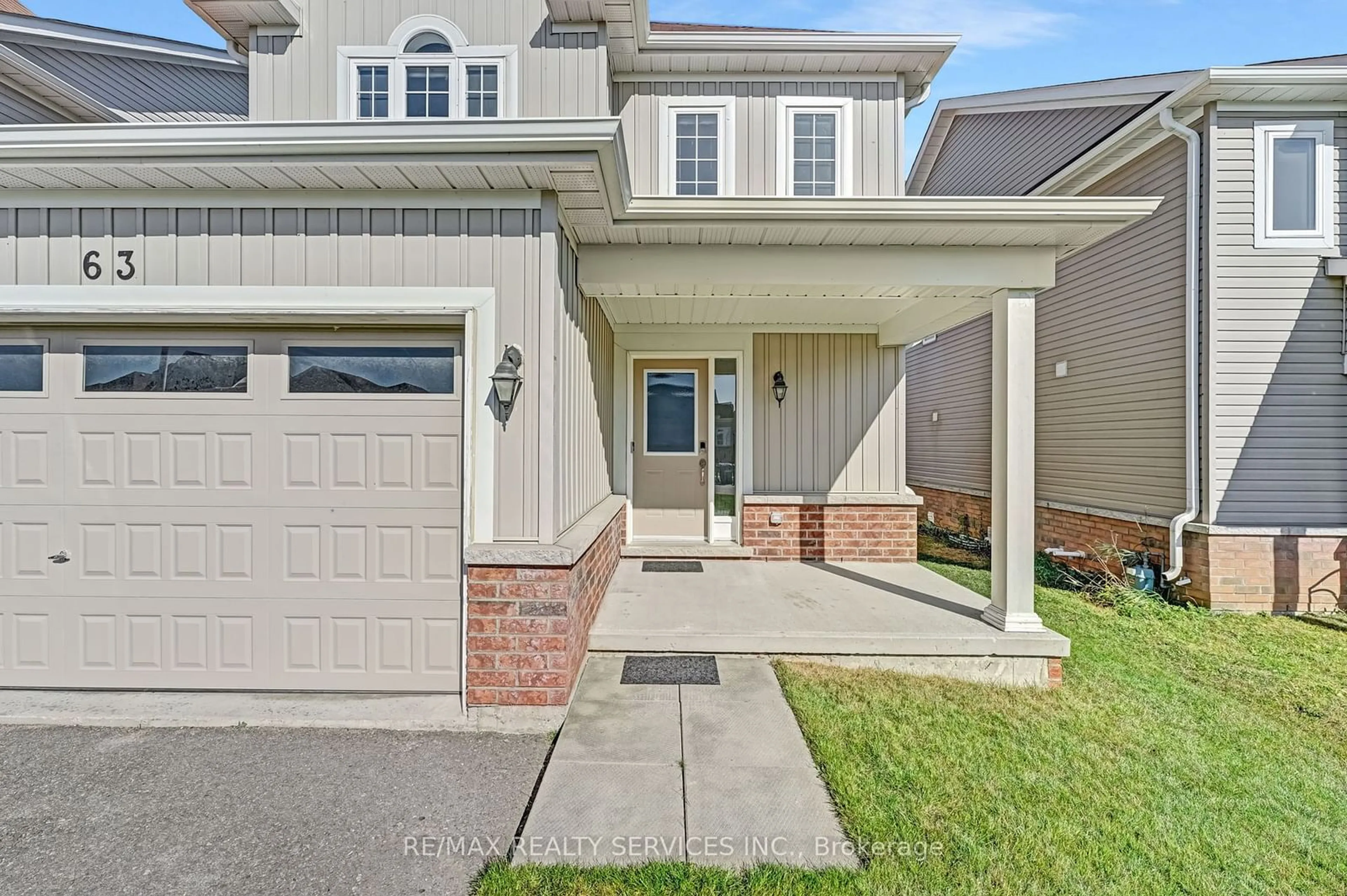 Home with vinyl exterior material, street for 63 Todd Cres, Southgate Ontario N0C 1B0