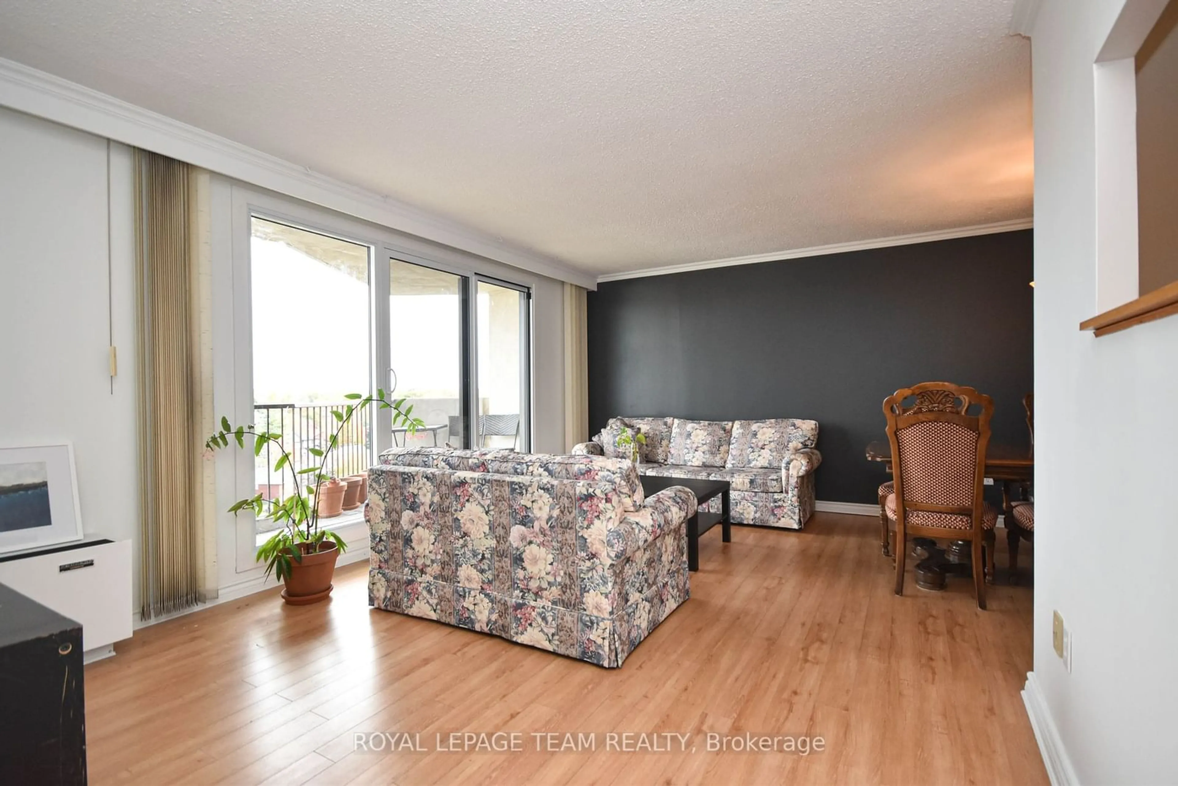 Living room with furniture, wood/laminate floor for 1025 Richmond Rd #1003, Woodroffe Ontario K2B 8G8