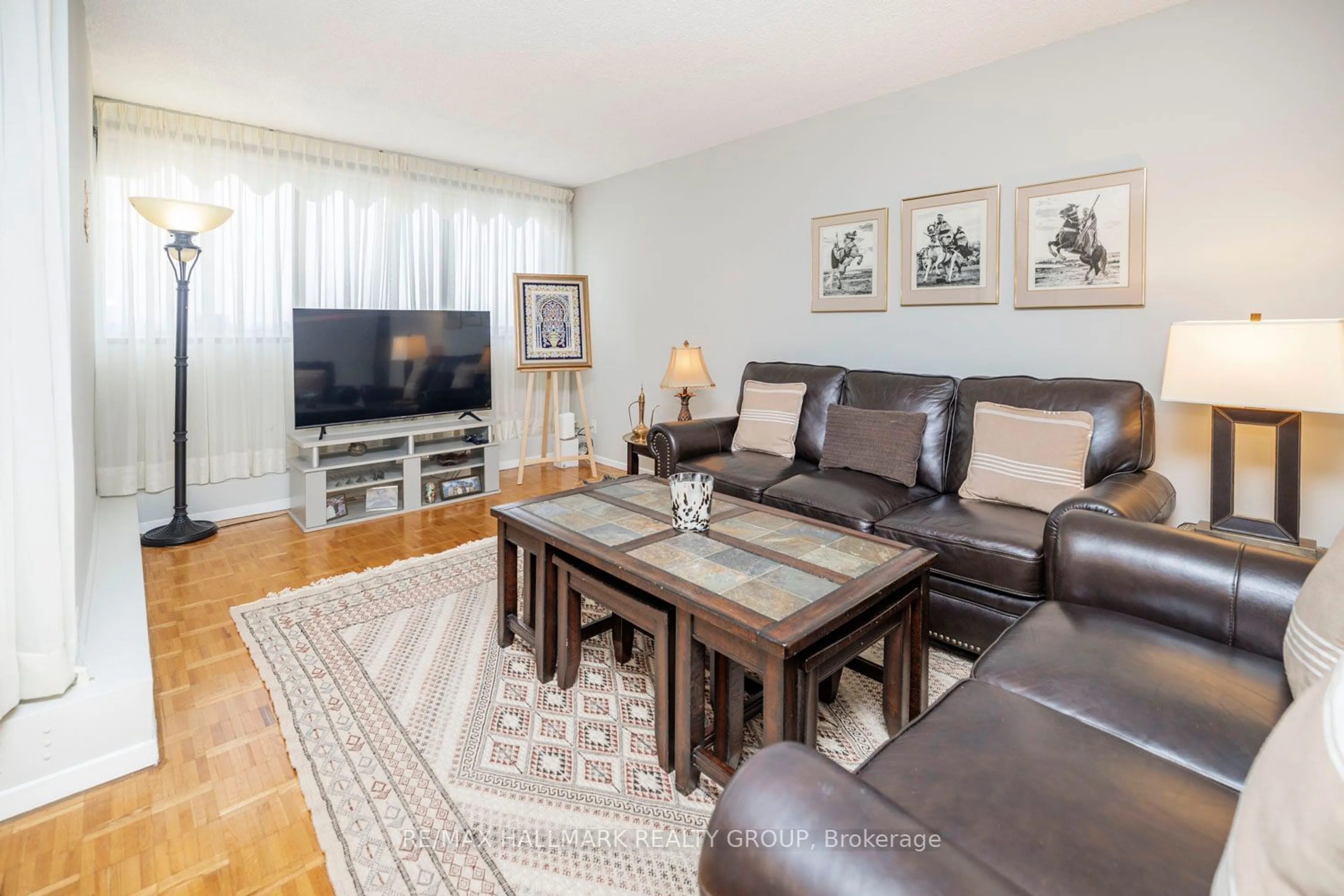 Living room with furniture, wood/laminate floor for 1285 Cahill Dr #1004, Hunt Club - South Keys and Area Ontario K1V 9A7