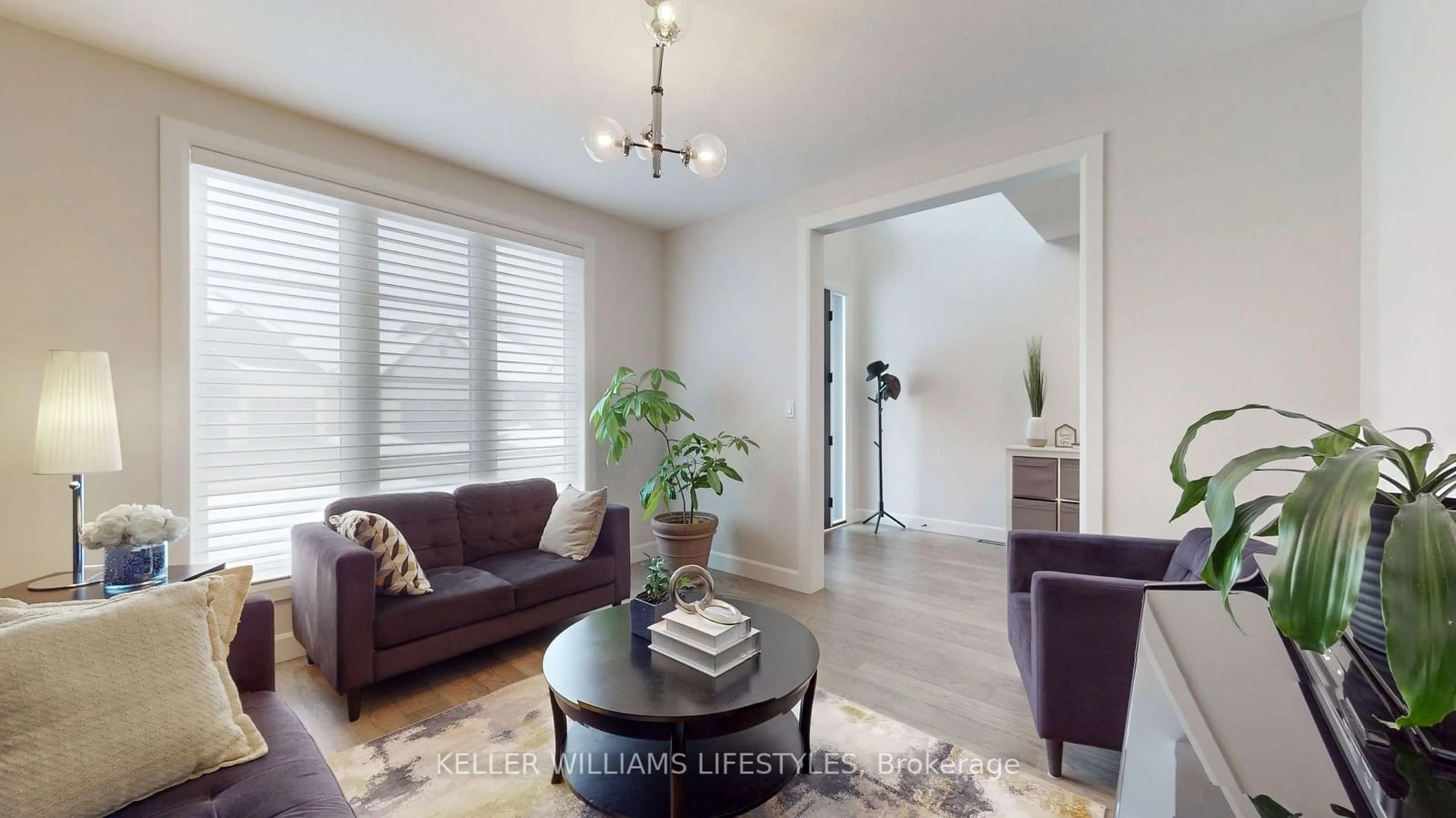 Living room with furniture, wood/laminate floor for 1968 Buroak Cres, London Ontario N6G 3X9