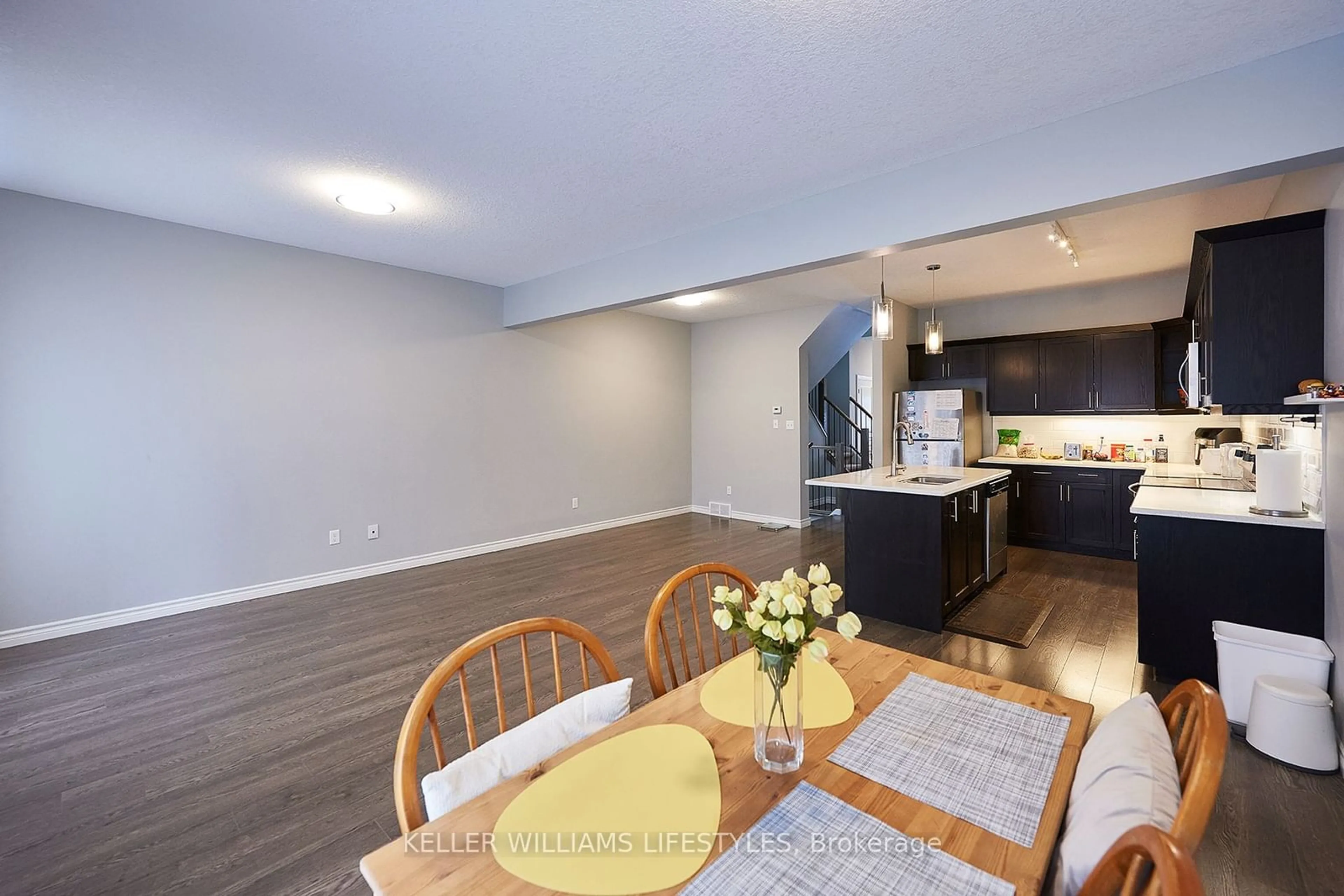 Open concept kitchen, wood/laminate floor for 1924 CEDARHOLLOW Blvd #83, London Ontario N5X 0K3