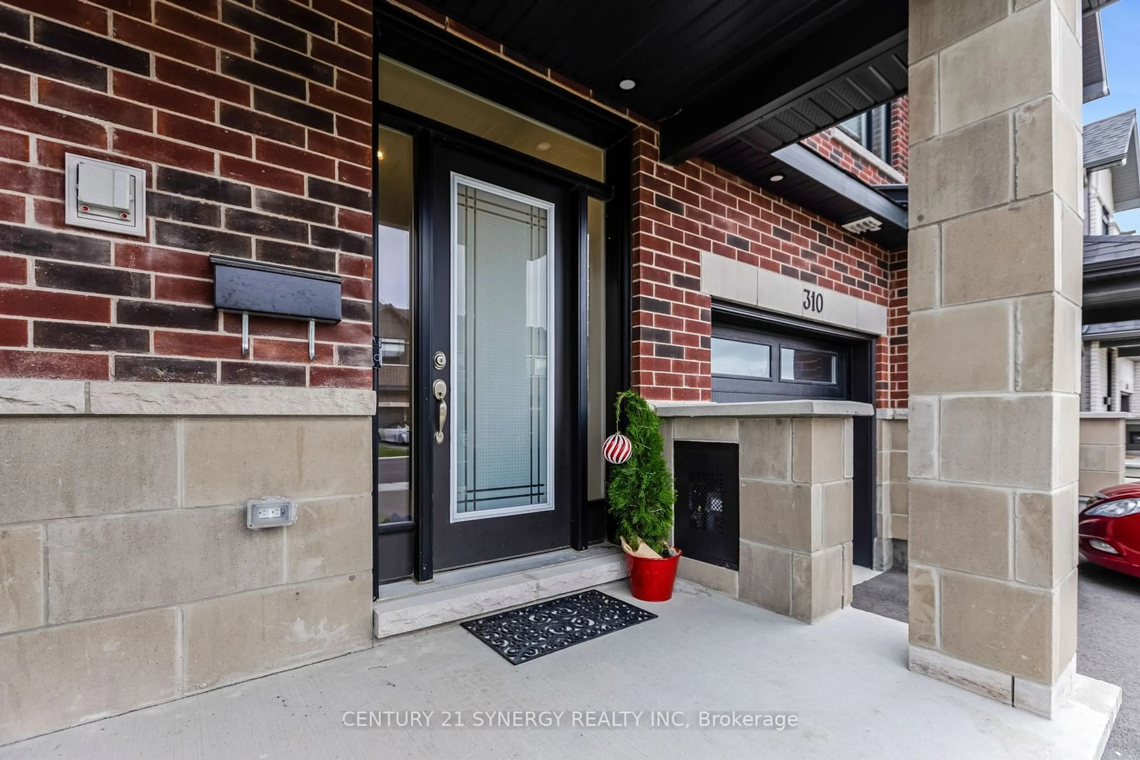 Home with brick exterior material, street for 310 Affogato Walk, Barrhaven Ontario K2J 4J7