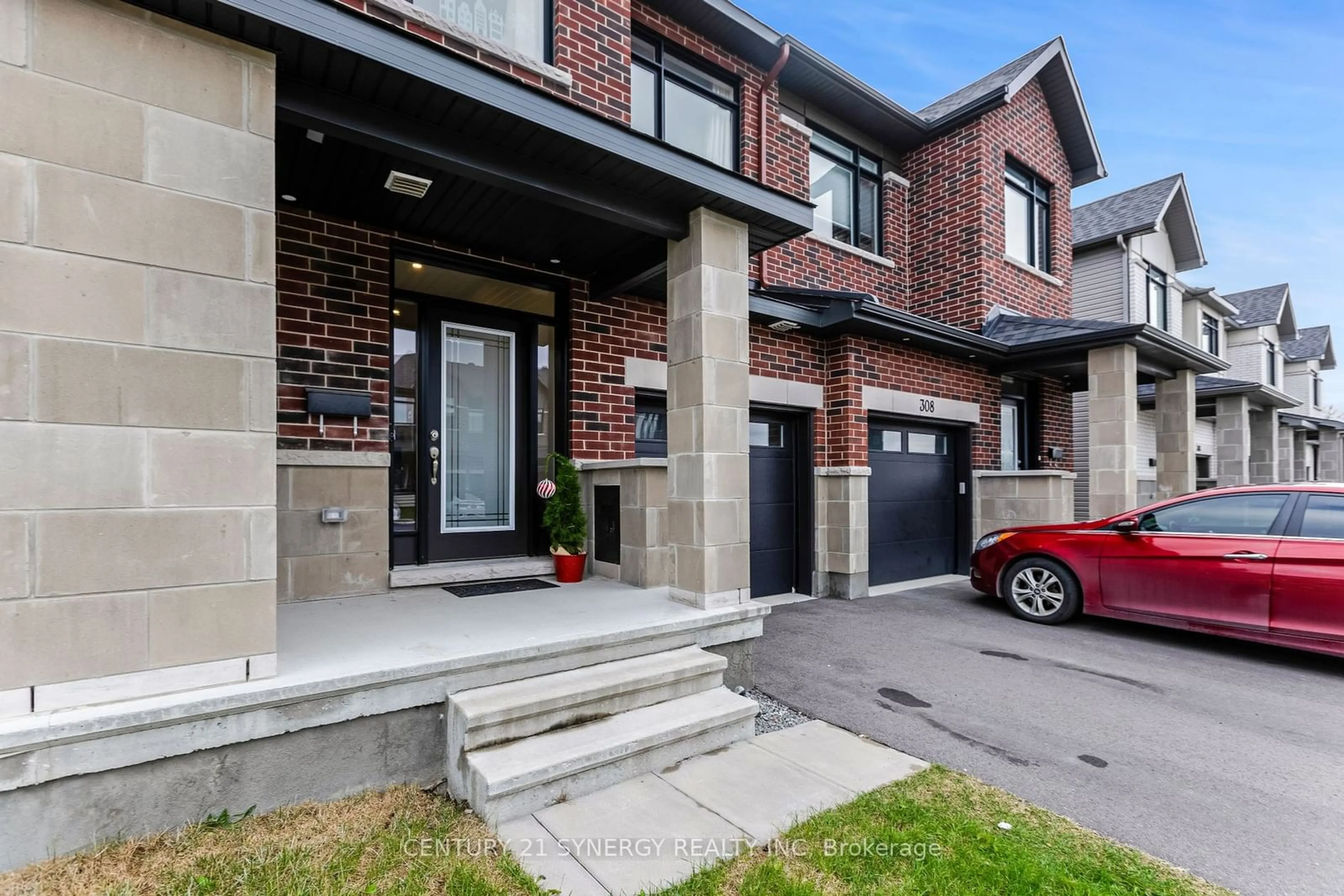 Home with brick exterior material, street for 310 Affogato Walk, Barrhaven Ontario K2J 4J7