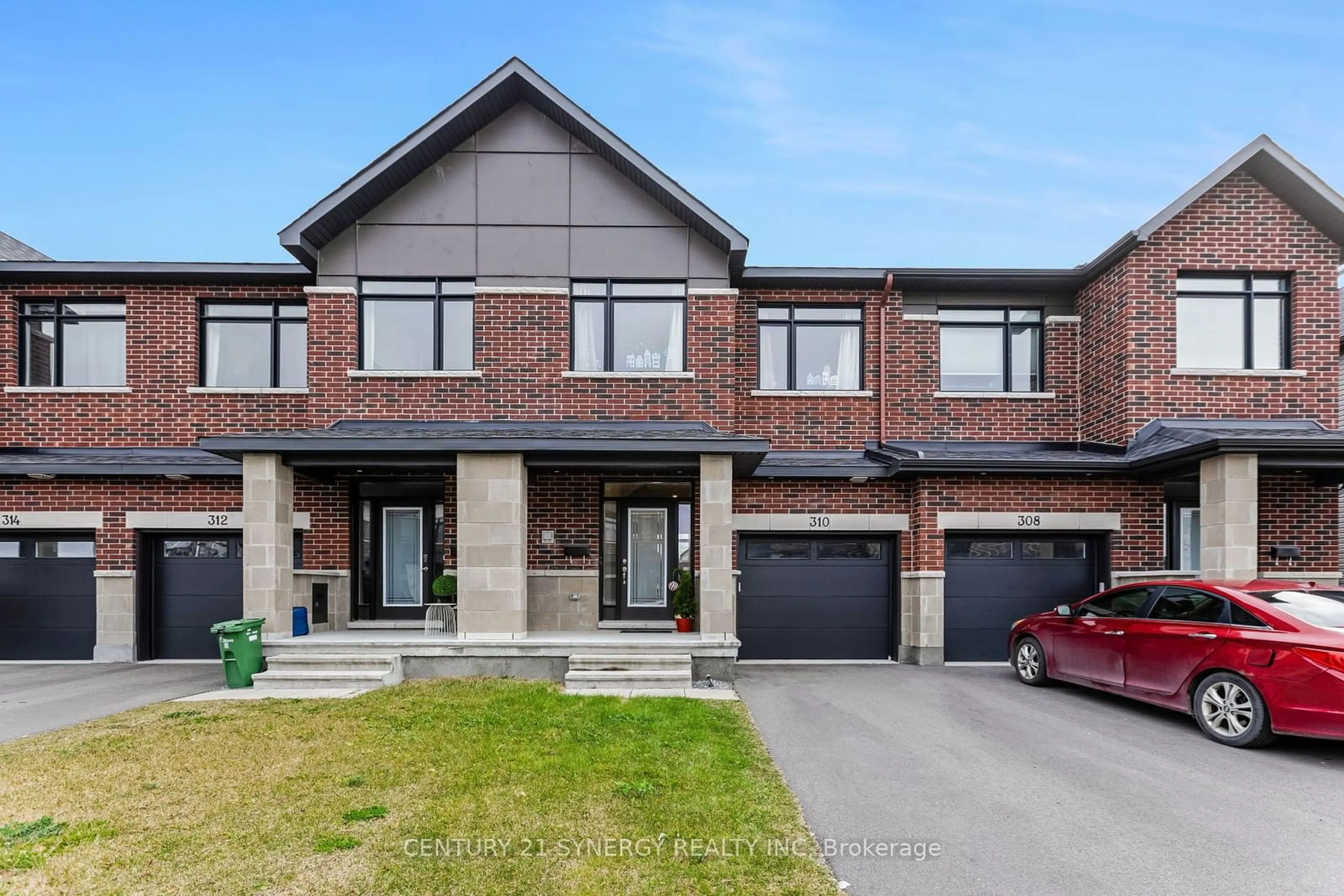 Home with brick exterior material, street for 310 Affogato Walk, Barrhaven Ontario K2J 4J7