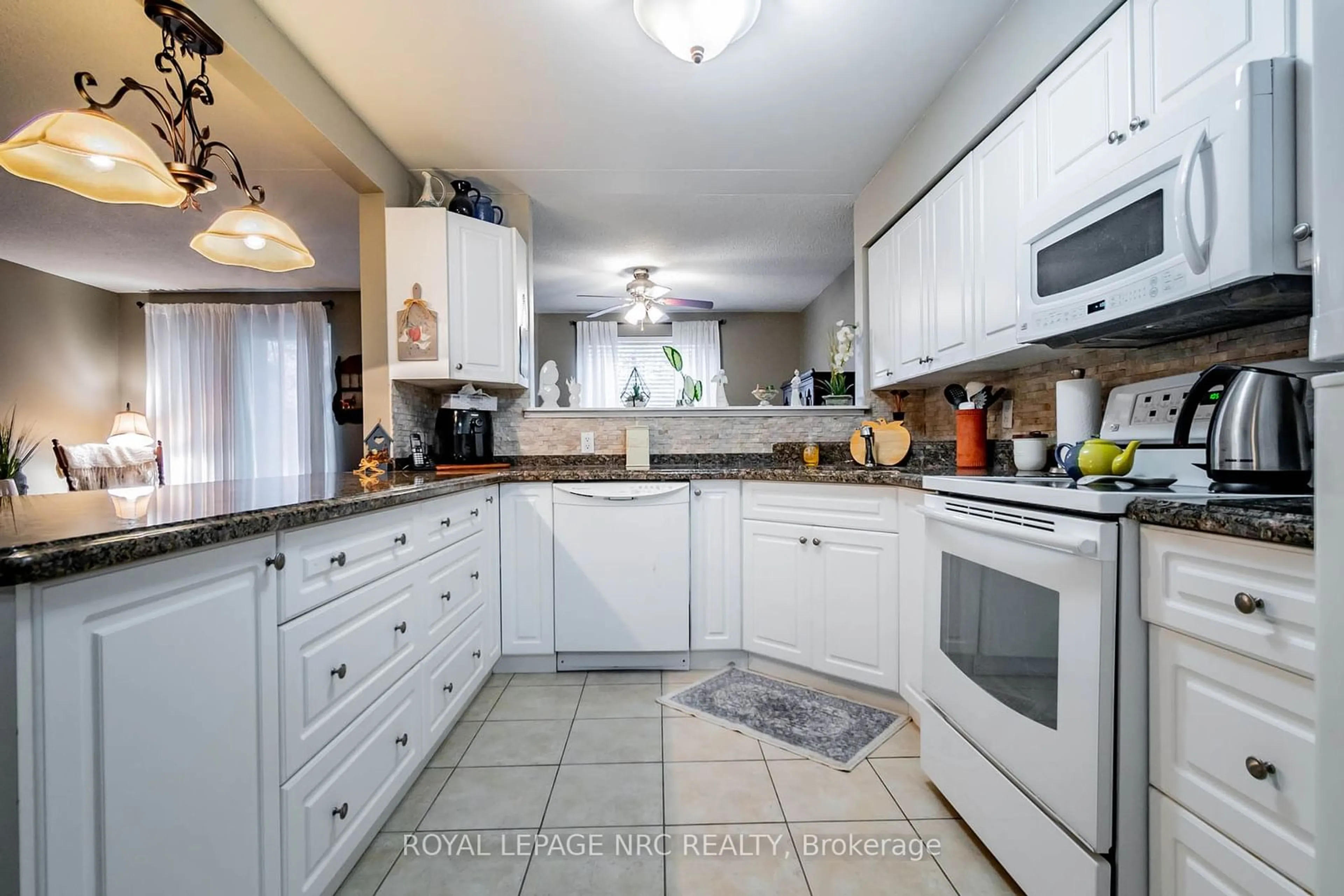 Standard kitchen, ceramic/tile floor for 4658 Drummond Rd #230, Niagara Falls Ontario L2E 7E1