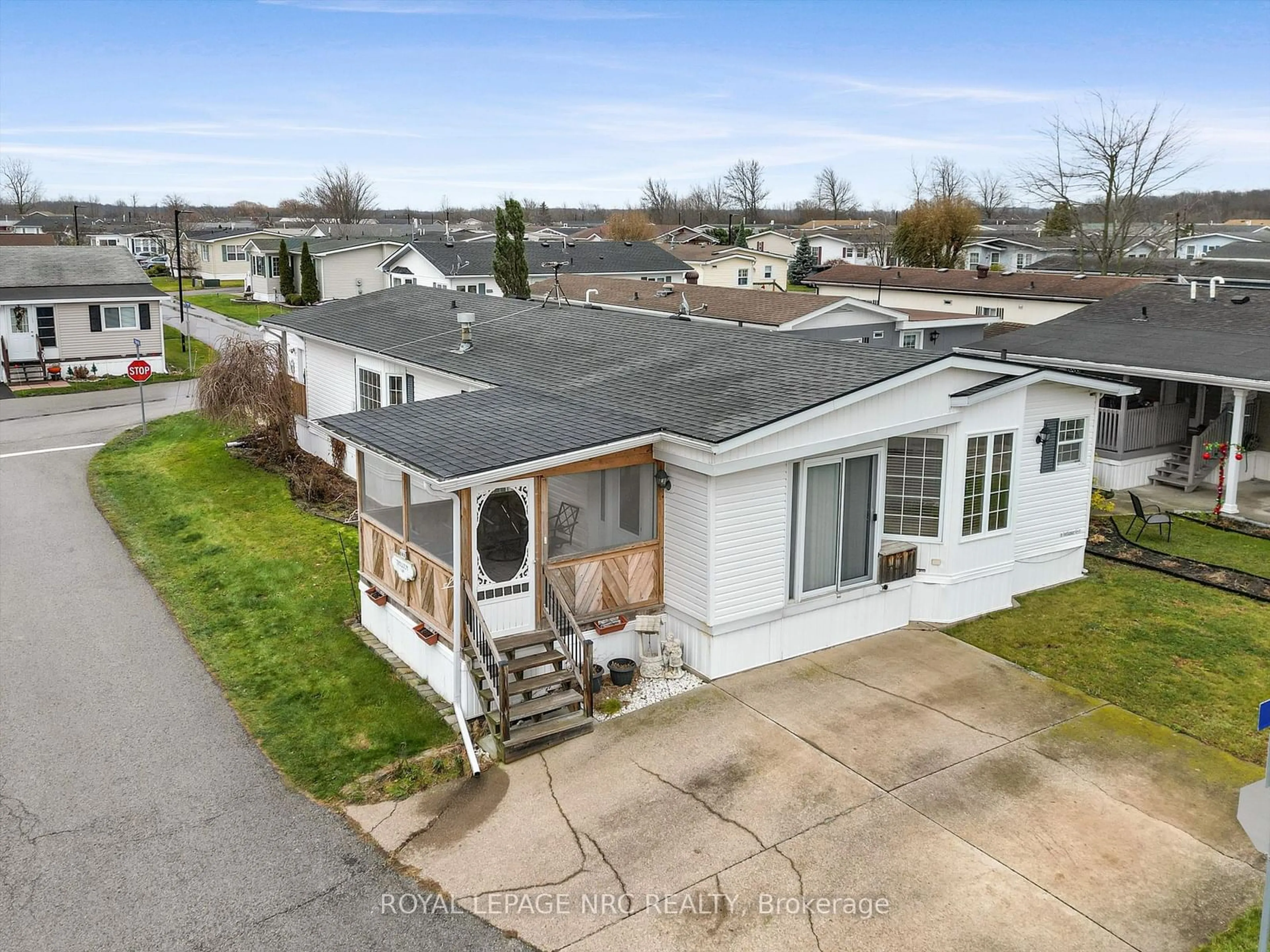 A pic from outside/outdoor area/front of a property/back of a property/a pic from drone, street for 3033 Townline Rd ##248, Fort Erie Ontario L0S 1S1