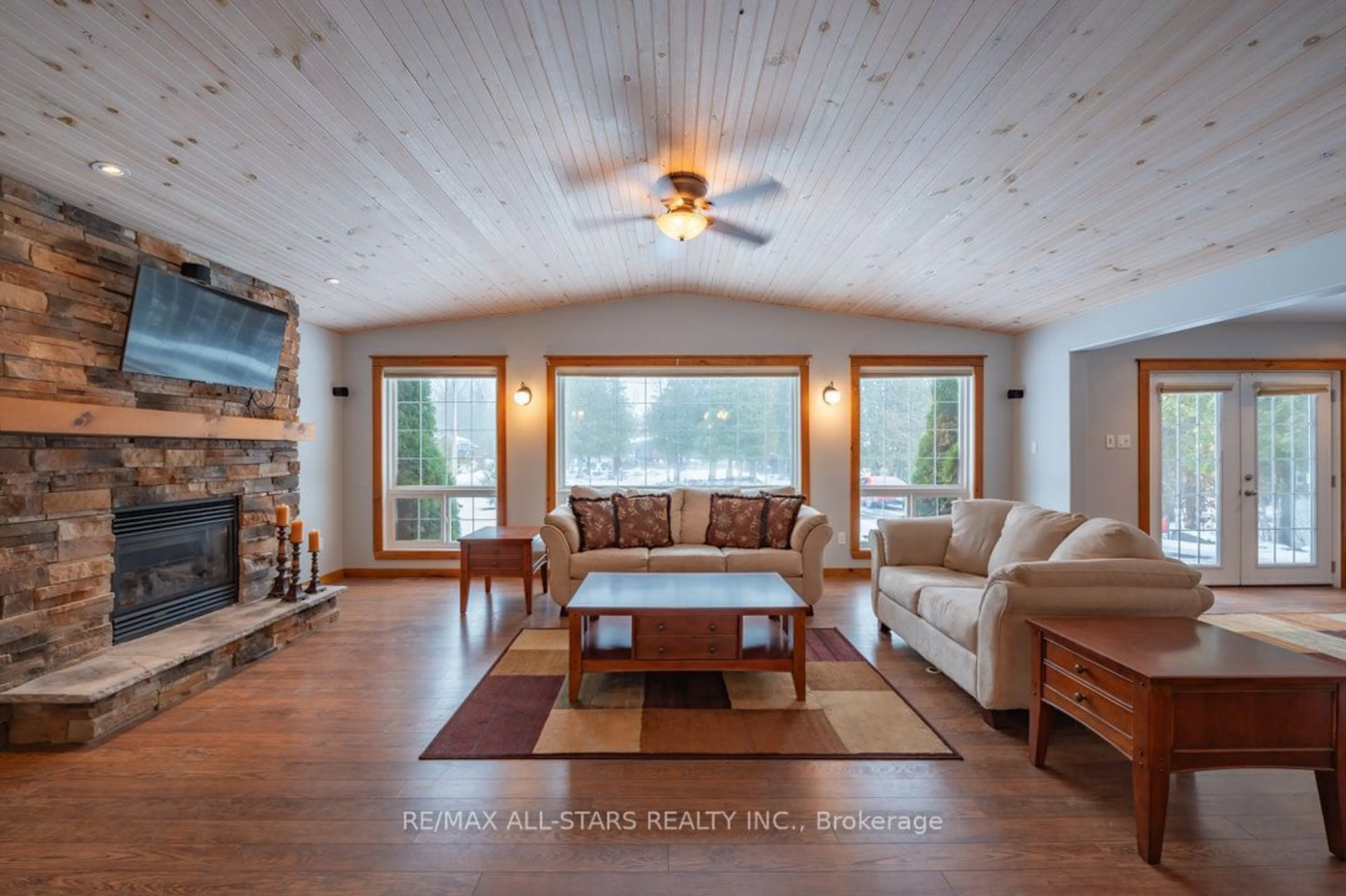 Living room with furniture, wood/laminate floor for 120 Echo Bay Rd, Kawartha Lakes Ontario K0M 1A0