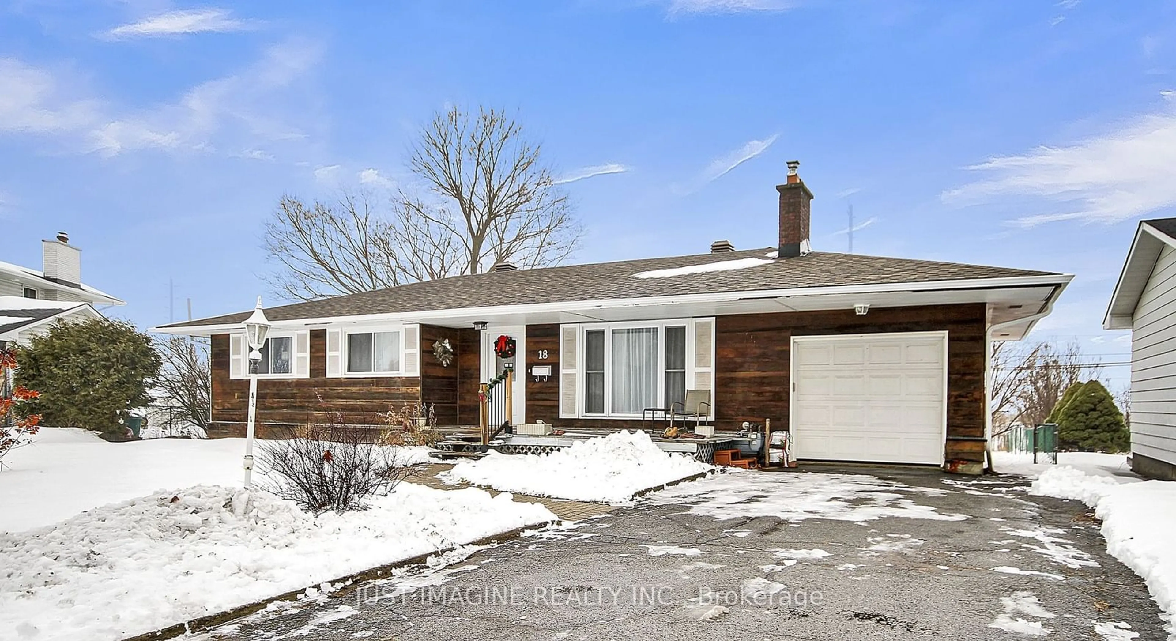 Home with brick exterior material, street for 18 Tripp Cres, Barrhaven Ontario K2J 1C6