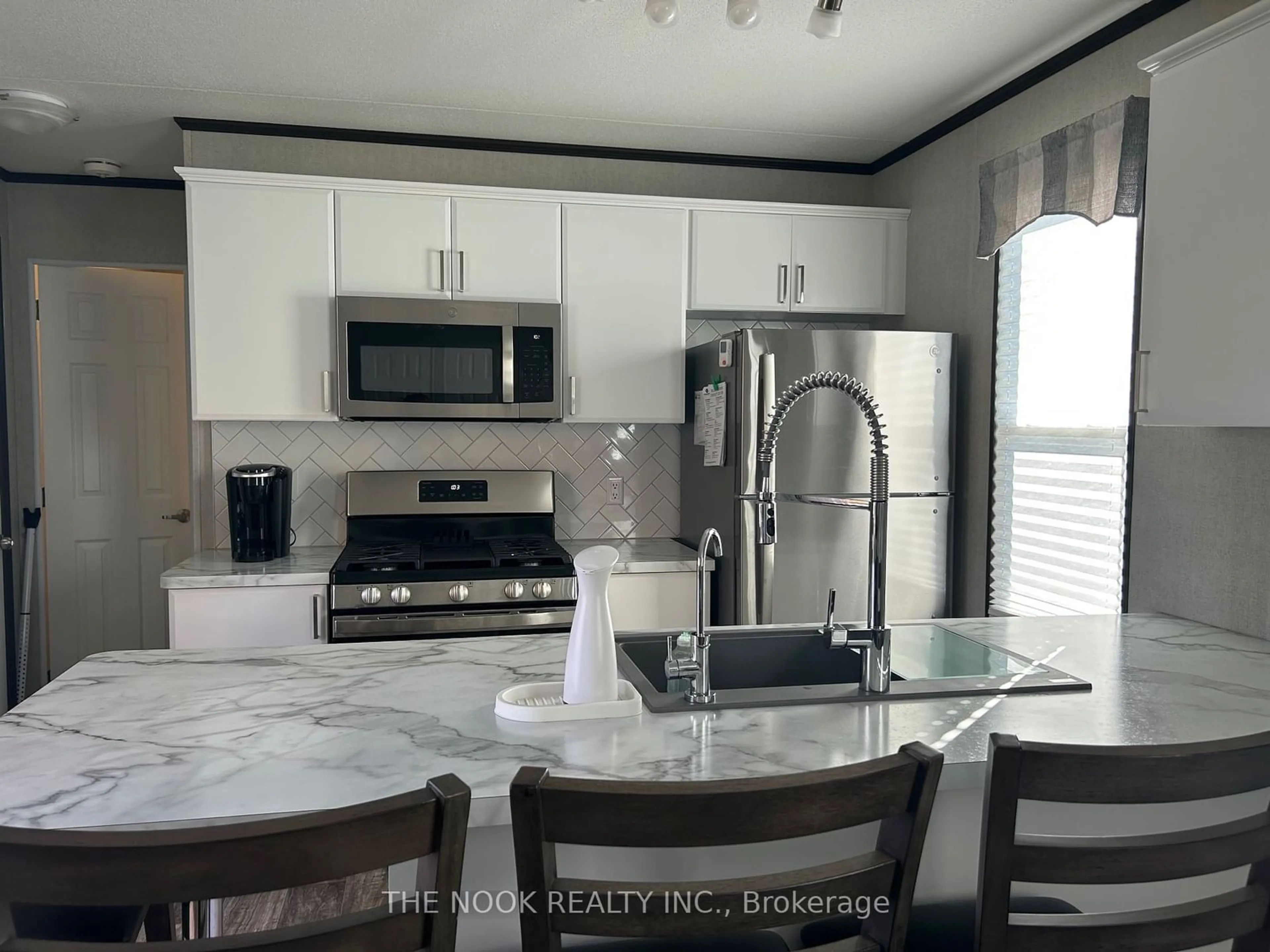 Open concept kitchen, ceramic/tile floor for 1235 Villiers Line #CHRY27, Otonabee-South Monaghan Ontario K0L 2G0