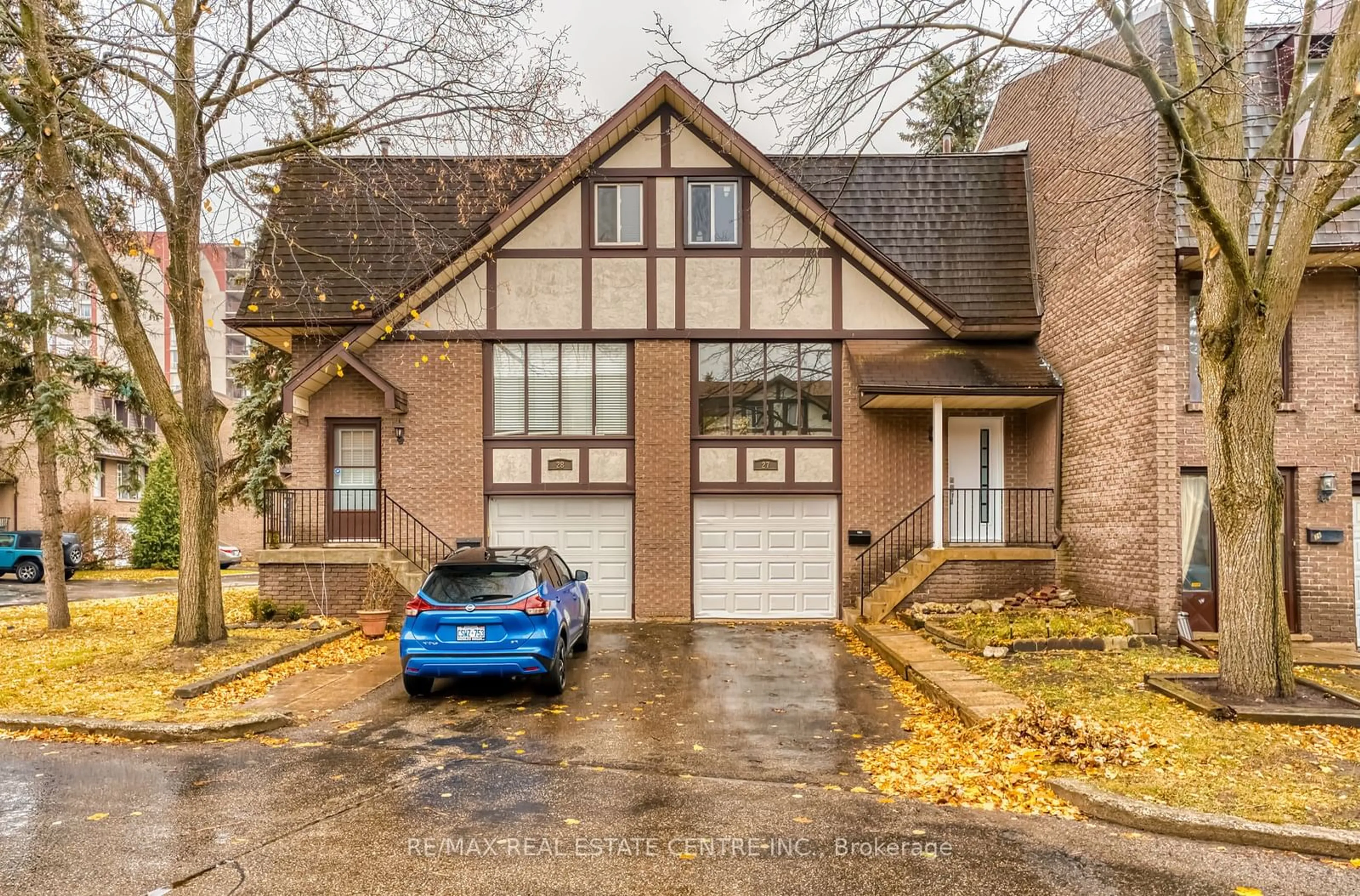 Home with brick exterior material, street for 49 Cedarwoods Cres #27, Kitchener Ontario N2C 2L1