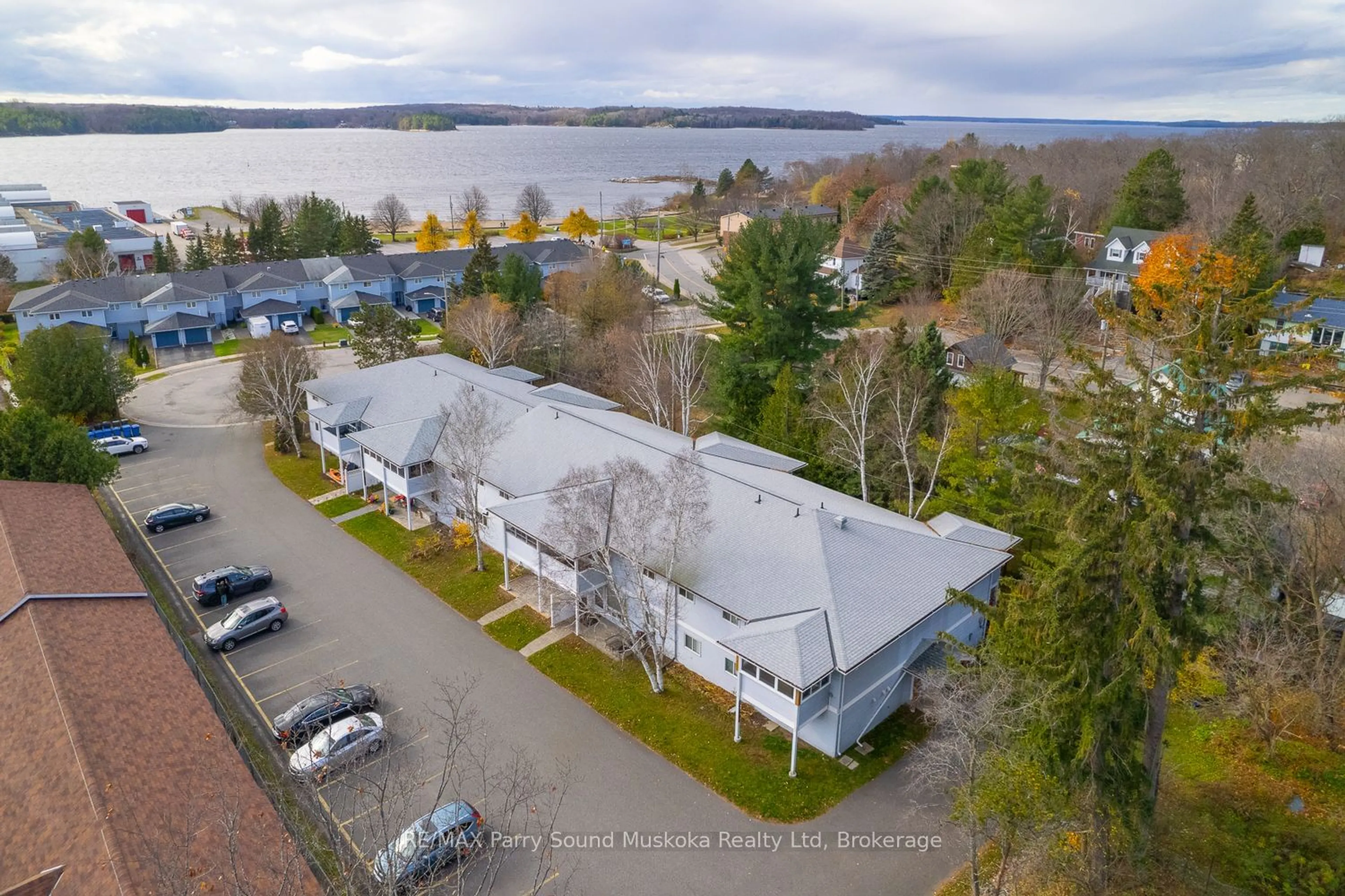 A pic from outside/outdoor area/front of a property/back of a property/a pic from drone, water/lake/river/ocean view for 1 Georgian Bay Ave #105, Parry Sound Ontario P2A 3B1