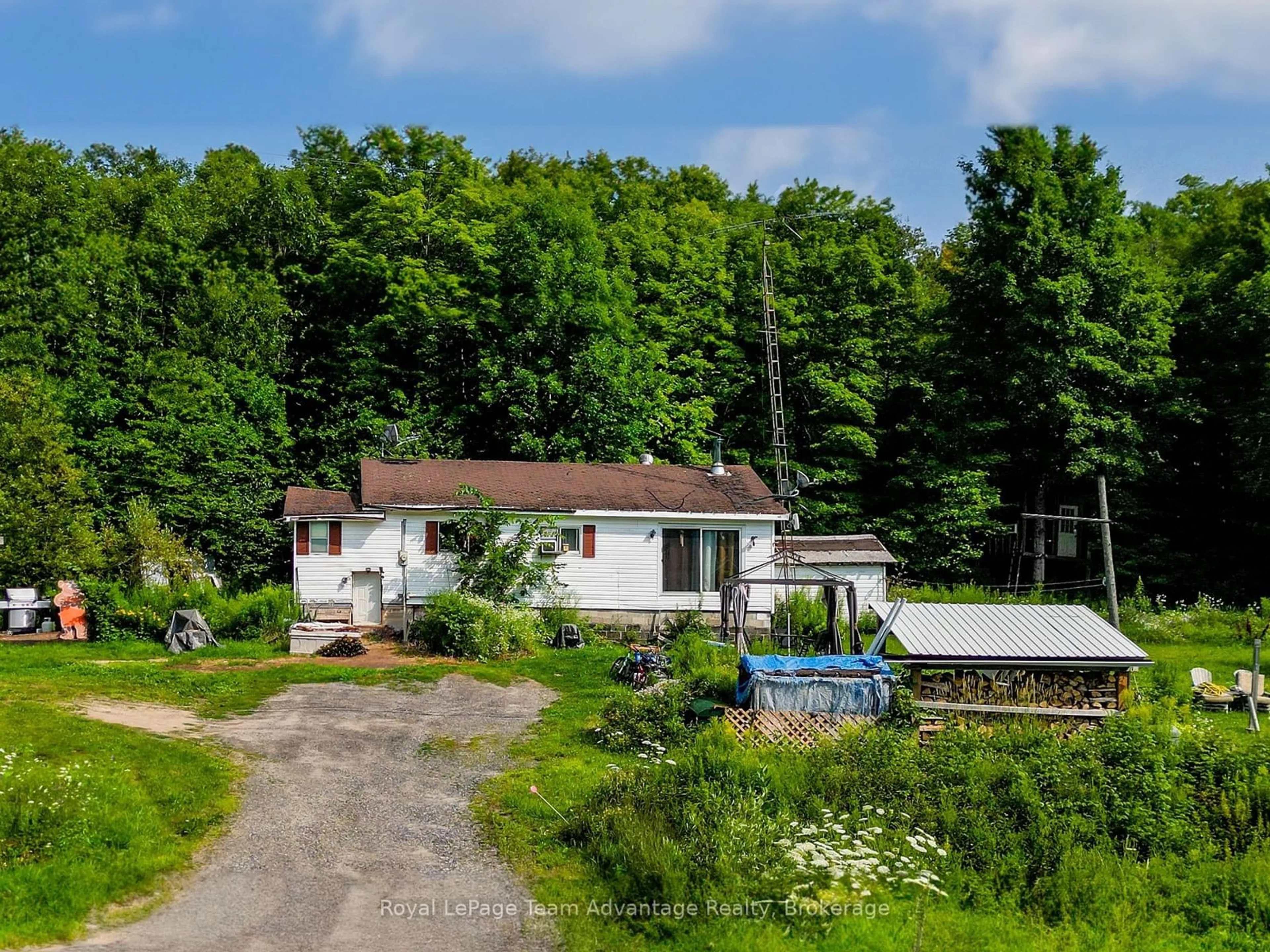 A pic from outside/outdoor area/front of a property/back of a property/a pic from drone, unknown for 407 Highway 124, McDougall Ontario P2A 2W7