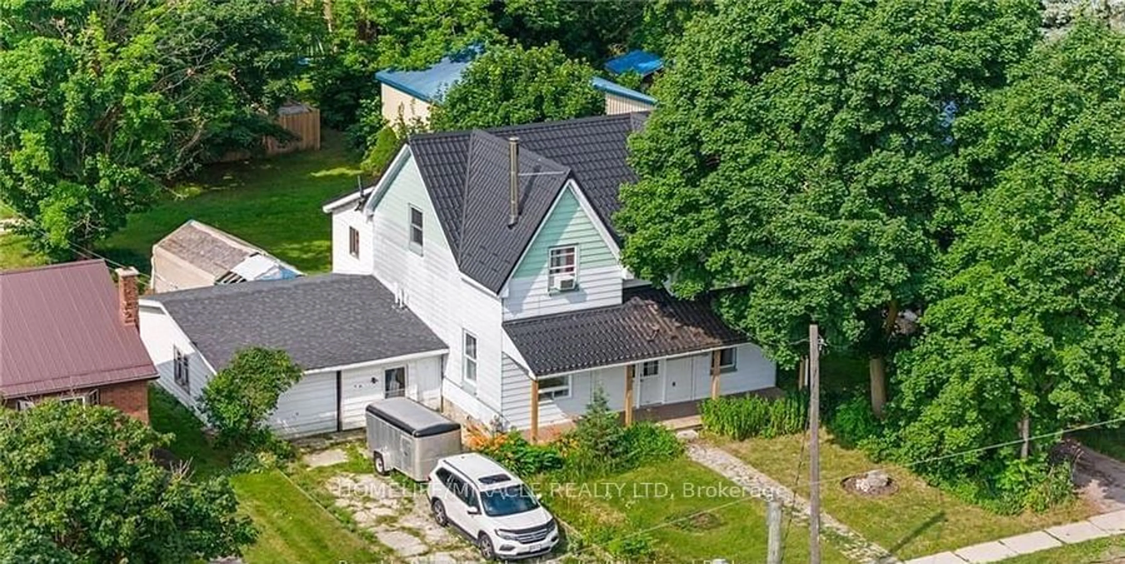 A pic from outside/outdoor area/front of a property/back of a property/a pic from drone, street for 22 William St, Minto Ontario N0G 1M0