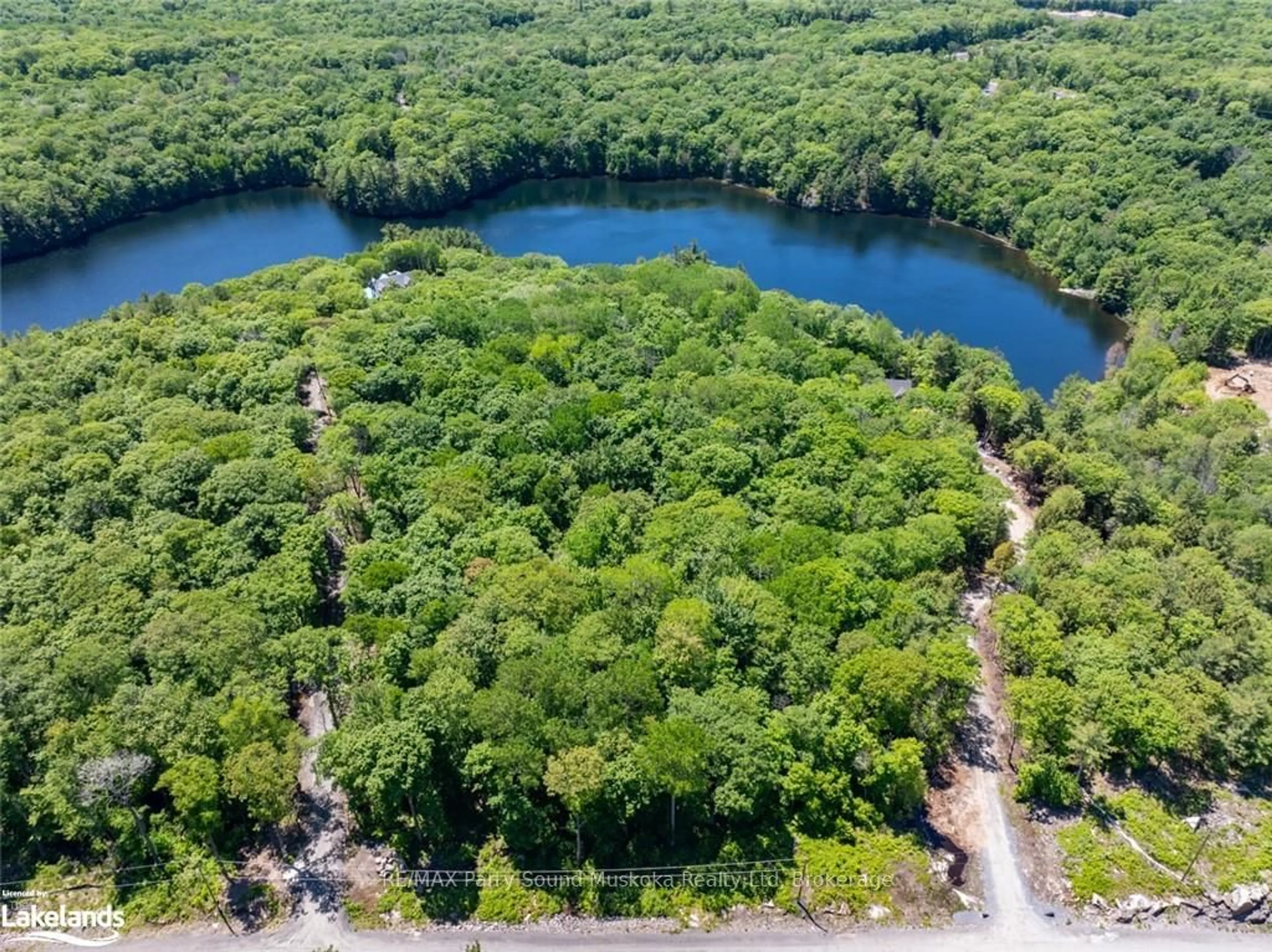 A pic from outside/outdoor area/front of a property/back of a property/a pic from drone, water/lake/river/ocean view for 21 WEE-GE-WA Rd, Seguin Ontario P2A 0B2