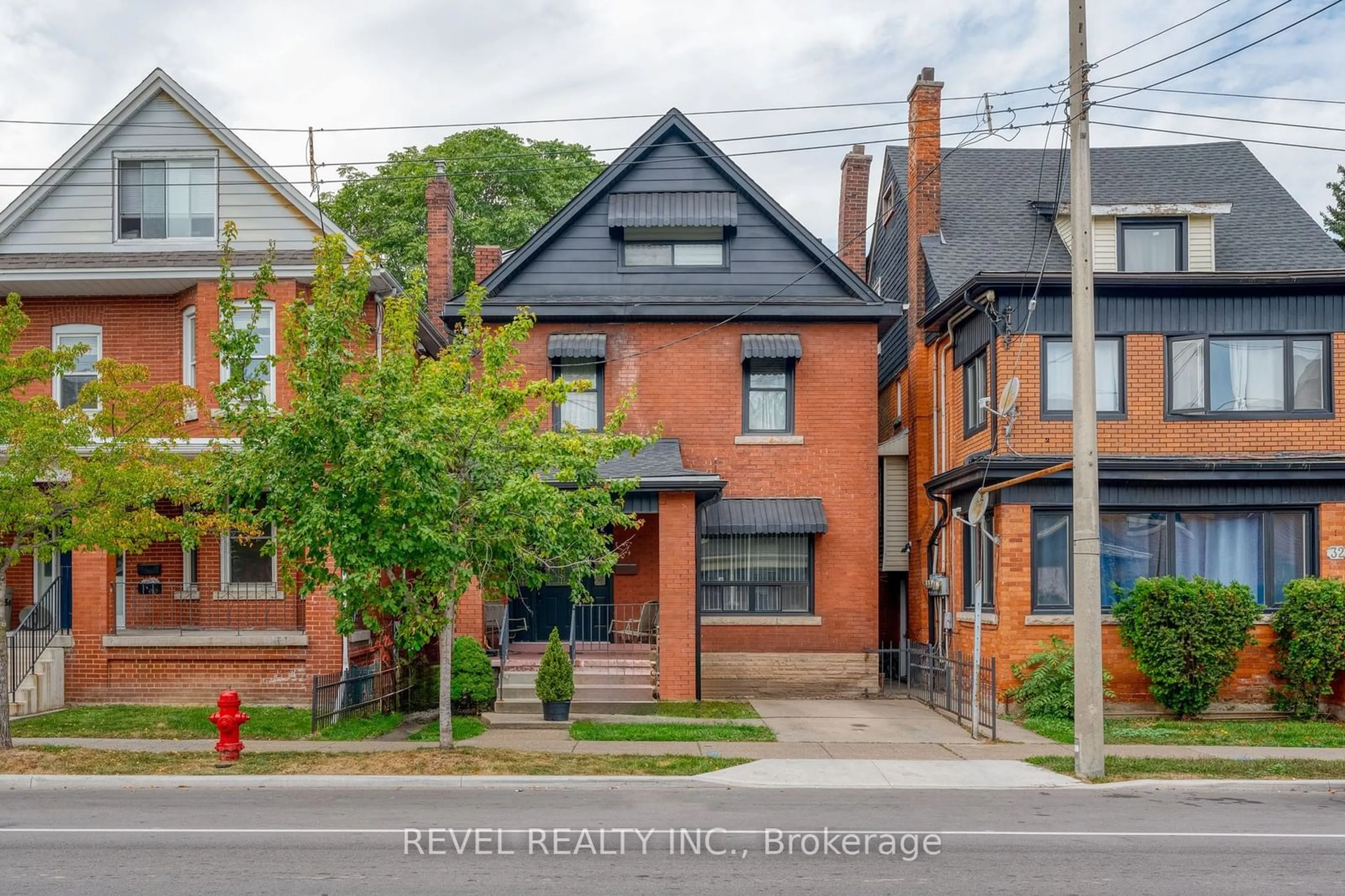 Home with brick exterior material, street for 34 Sherman Ave, Hamilton Ontario L8M 2P4