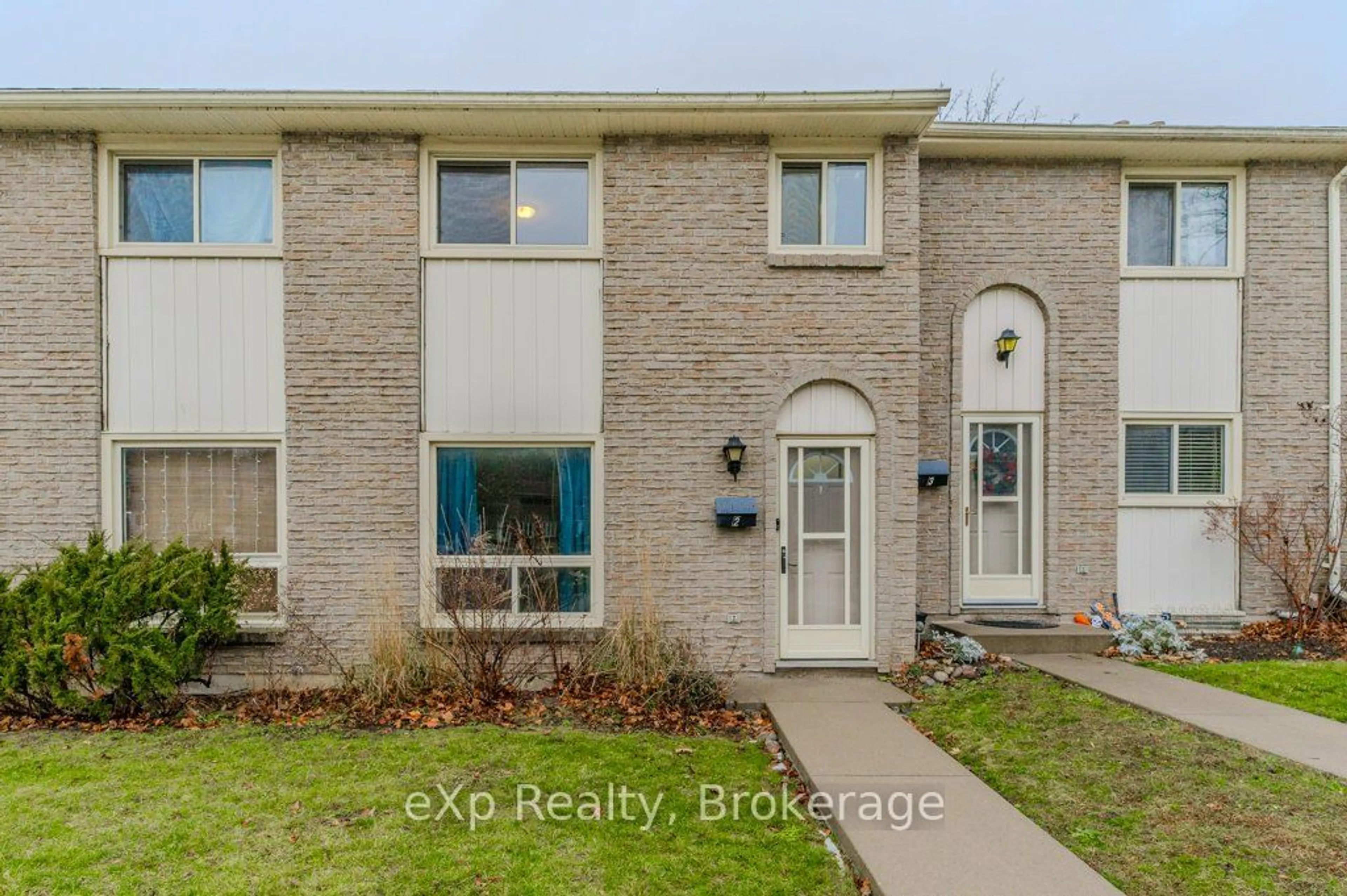 Home with brick exterior material, street for 165 Green Valley Dr #2, Kitchener Ontario N2P 1K3