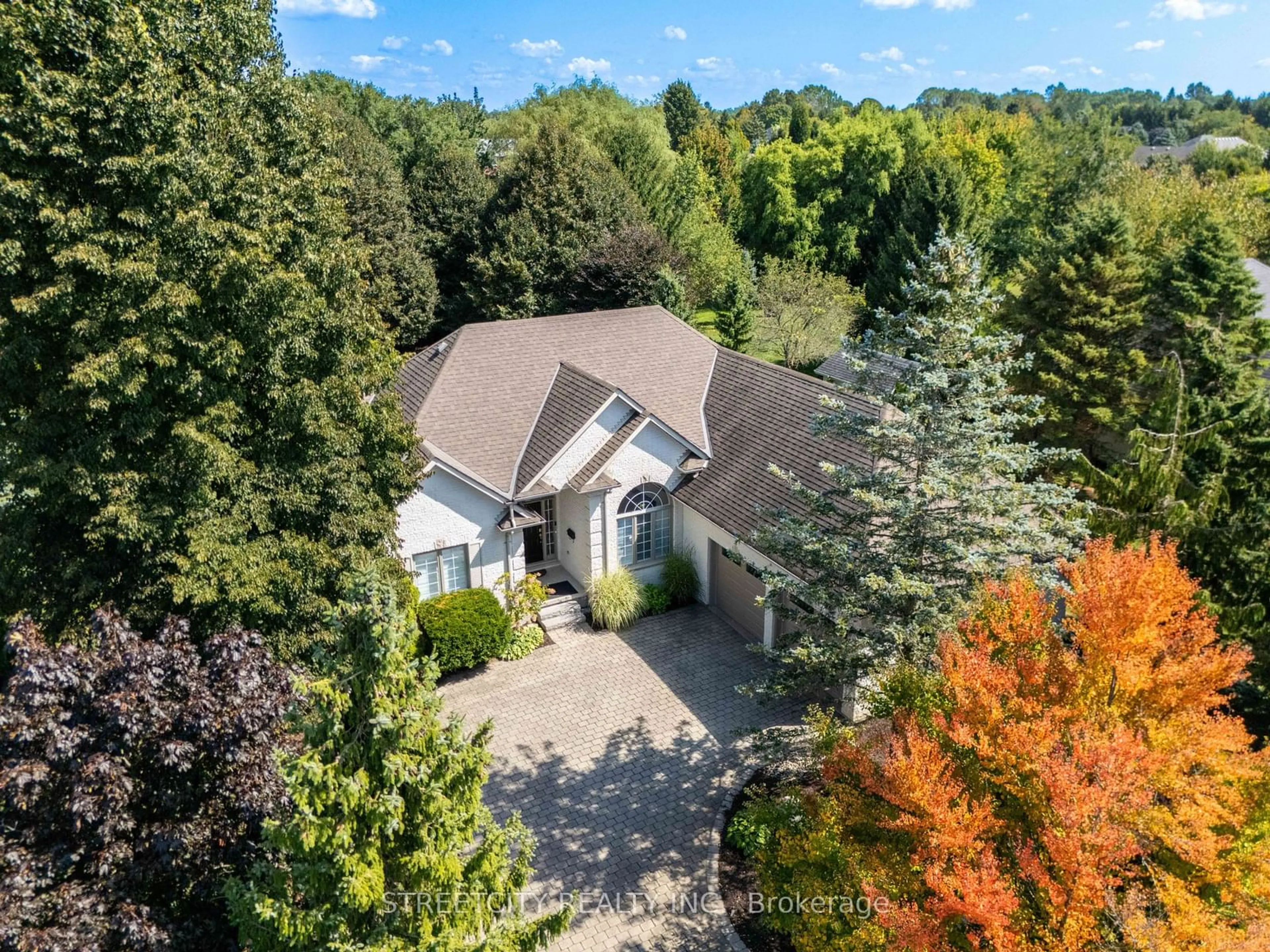 A pic from outside/outdoor area/front of a property/back of a property/a pic from drone, forest/trees view for 27 Wynfield Lane, Middlesex Centre Ontario N6H 5L2