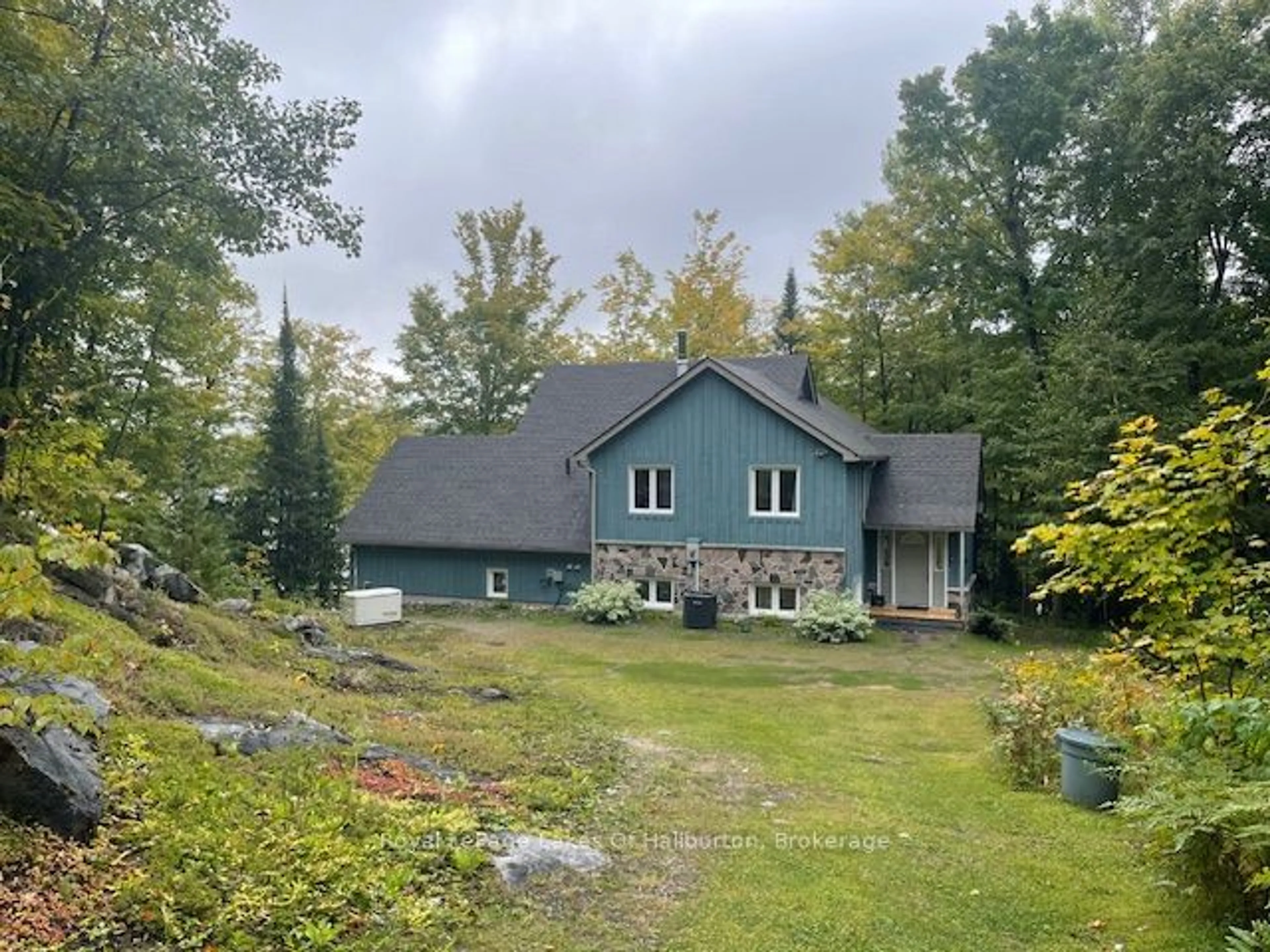 A pic from outside/outdoor area/front of a property/back of a property/a pic from drone, unknown for 48 Russell Dr, Minden Hills Ontario K0M 2A0