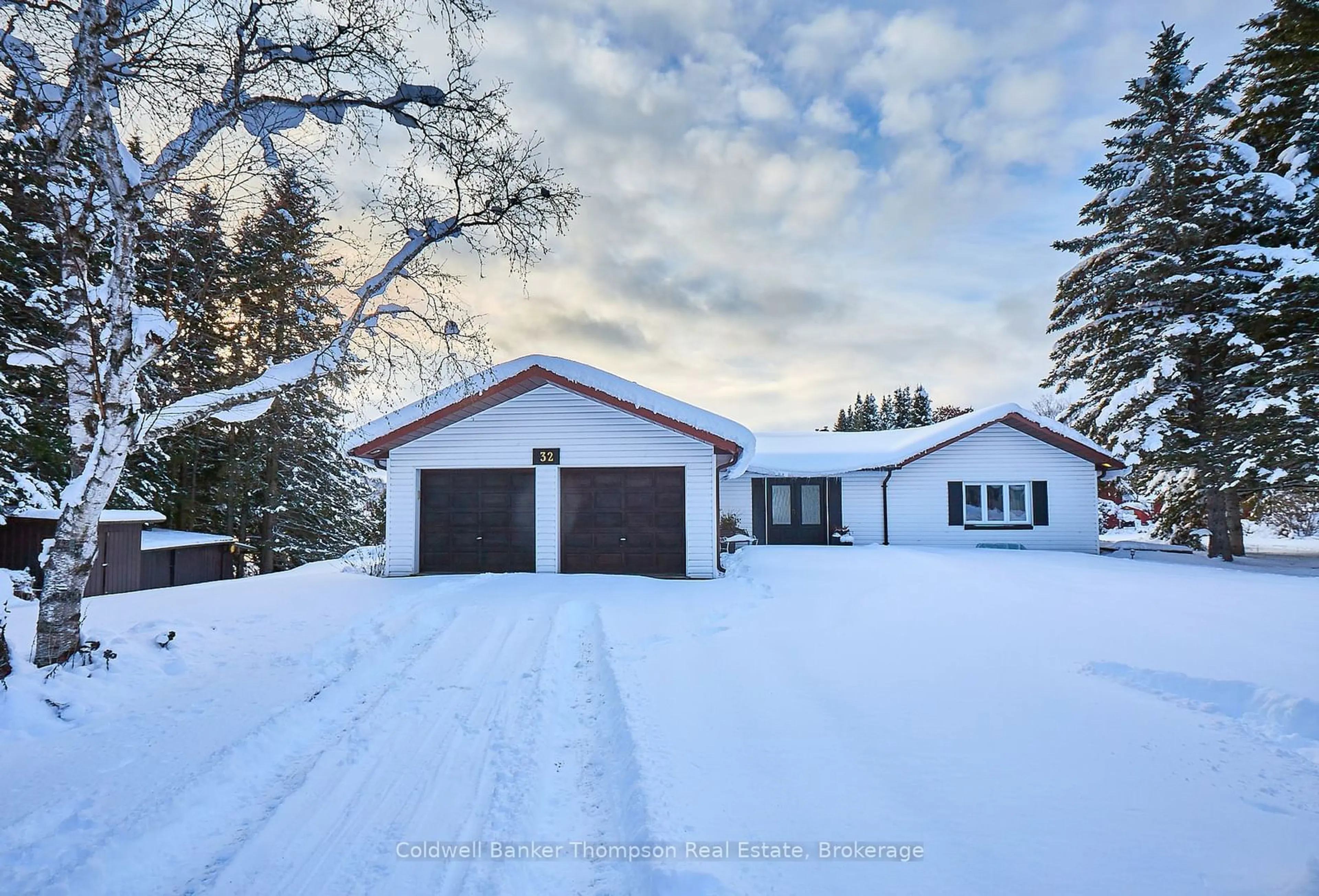 A pic from outside/outdoor area/front of a property/back of a property/a pic from drone, street for 32 Beach Rd, Huntsville Ontario P0B 1M0