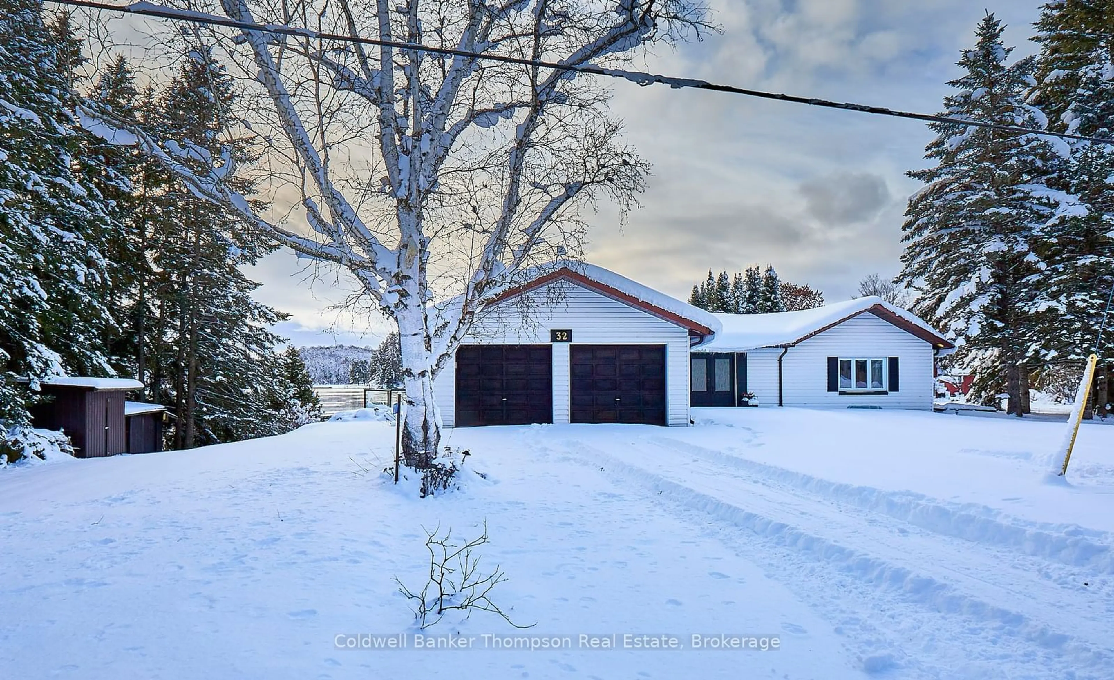 A pic from outside/outdoor area/front of a property/back of a property/a pic from drone, street for 32 Beach Rd, Huntsville Ontario P0B 1M0