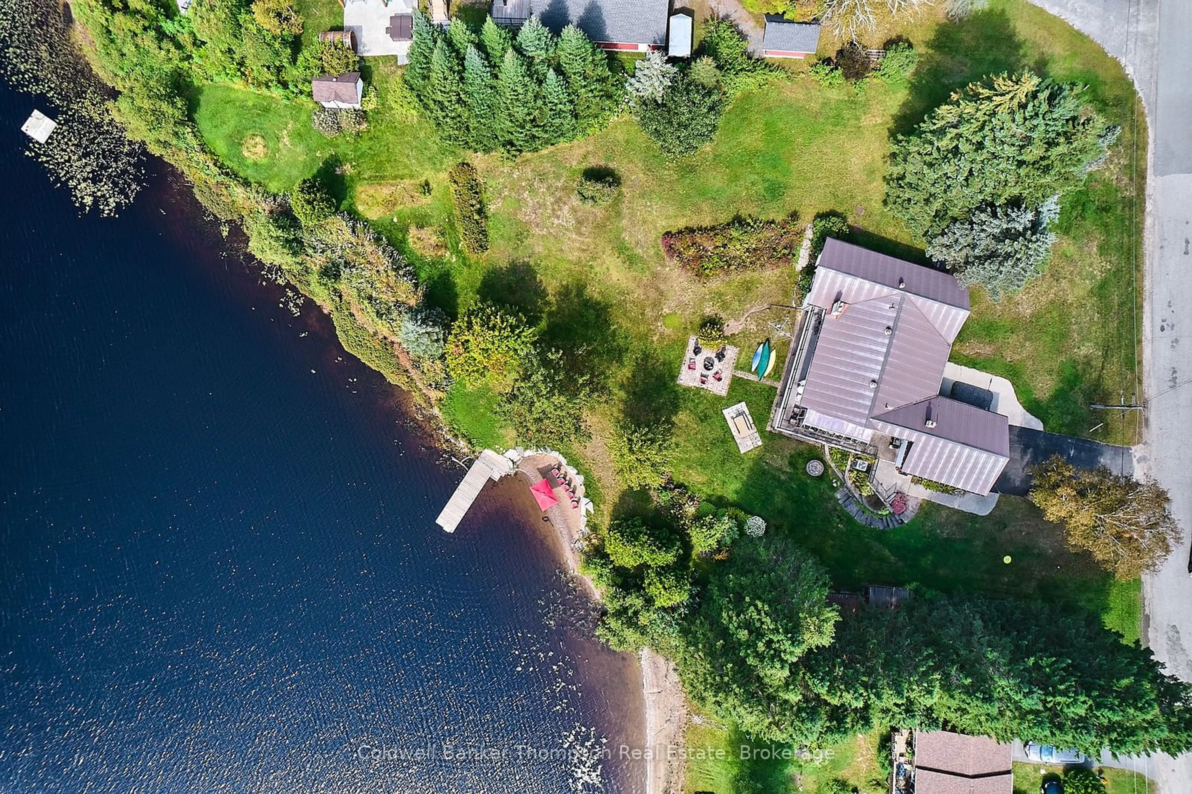 A pic from outside/outdoor area/front of a property/back of a property/a pic from drone, water/lake/river/ocean view for 32 Beach Rd, Huntsville Ontario P0B 1M0