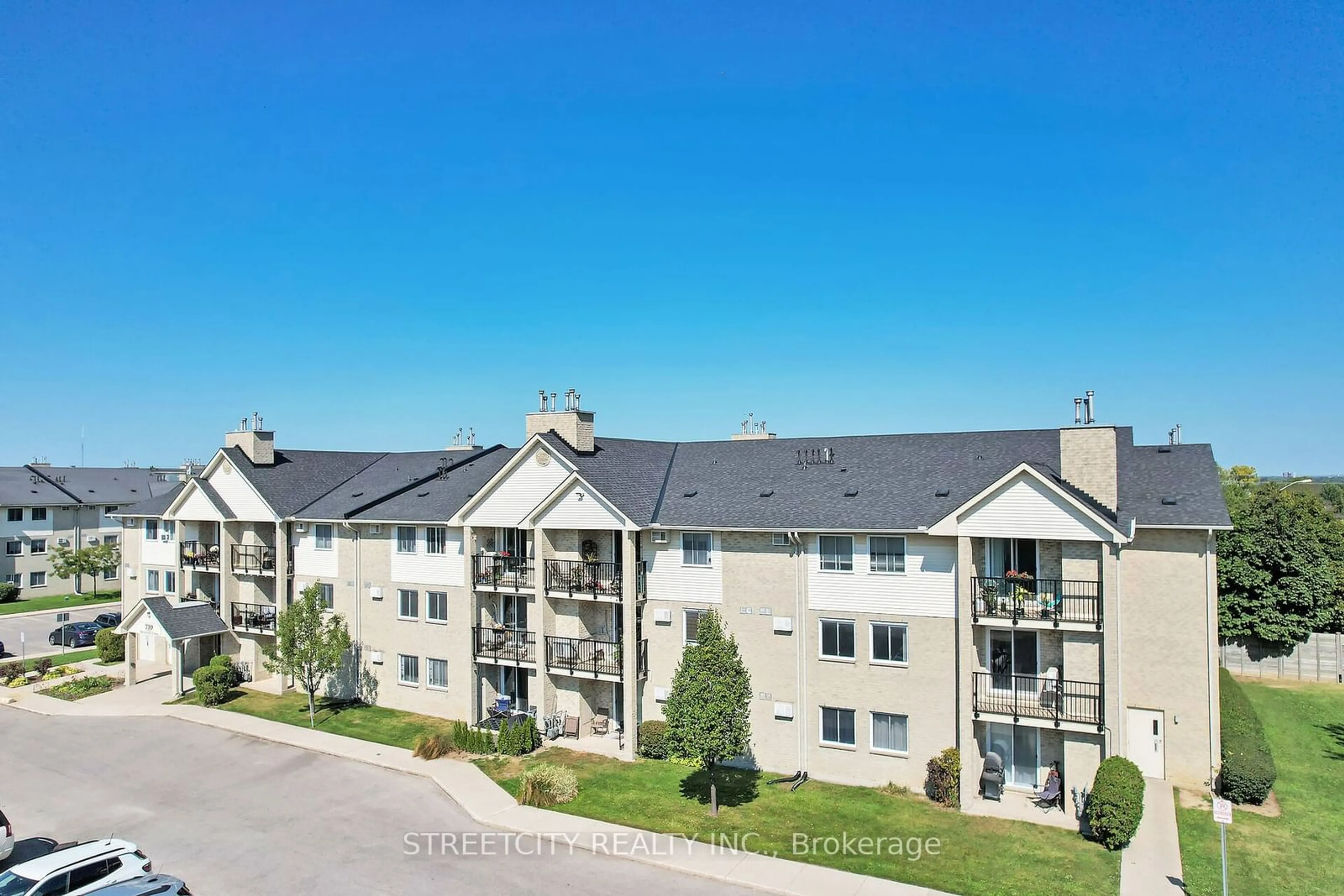 A pic from outside/outdoor area/front of a property/back of a property/a pic from drone, unknown for 739 Deveron Cres #209, London Ontario N5Z 4Y1