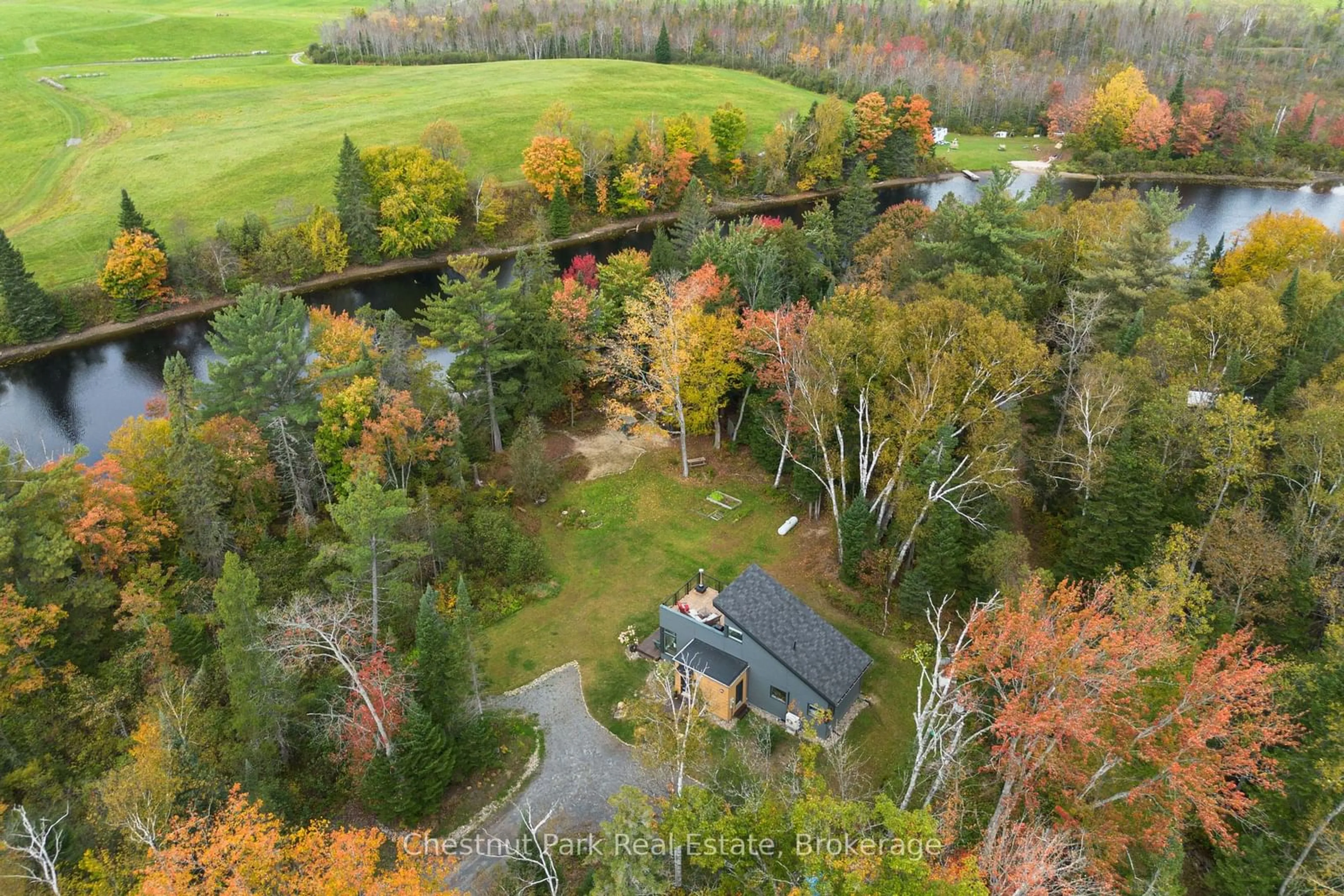 A pic from outside/outdoor area/front of a property/back of a property/a pic from drone, forest/trees view for 470 Markles Rd, Huntsville Ontario P1H 0J1