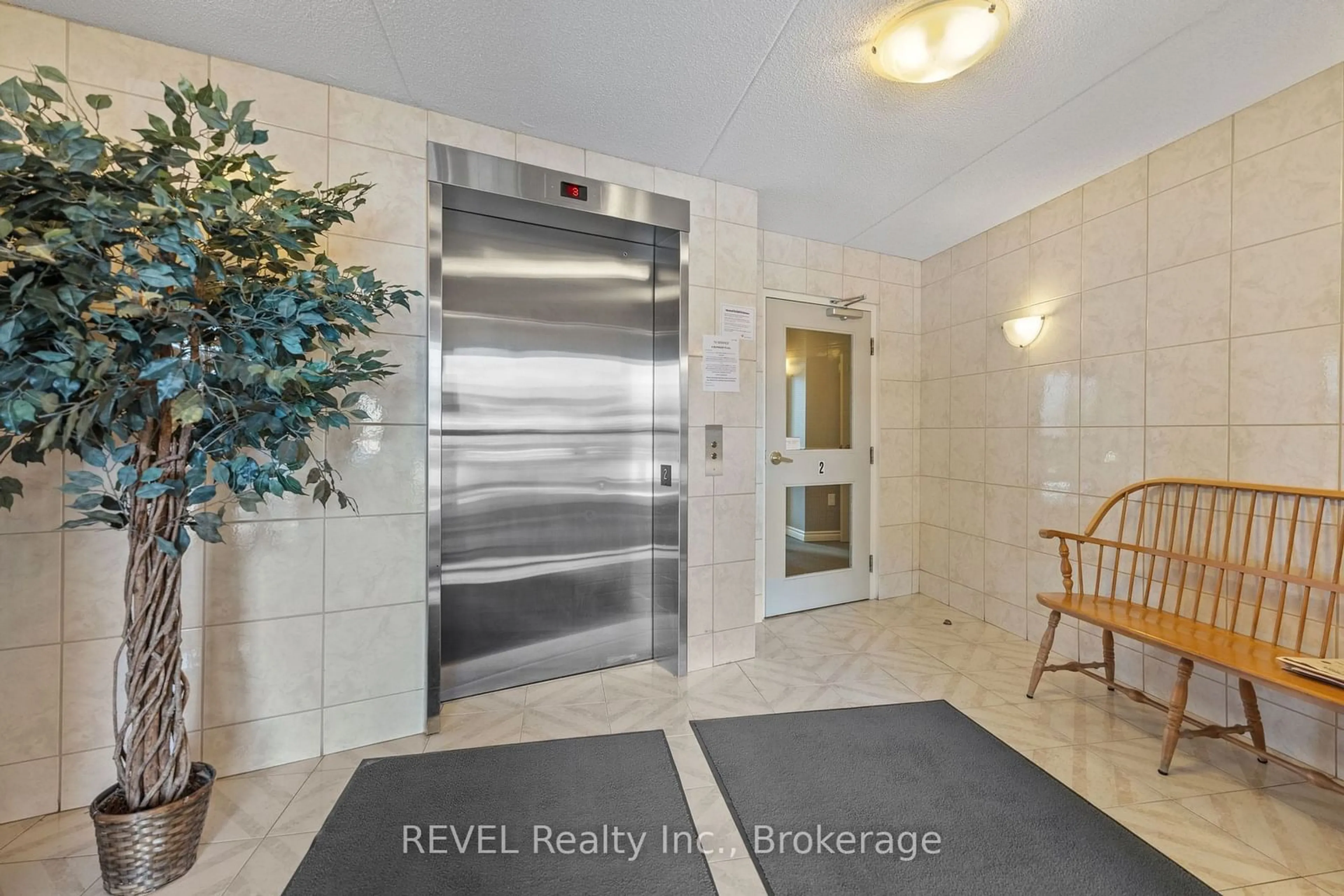 Indoor foyer for 244 Lakeshore Rd #303, St. Catharines Ontario L2M 1R6