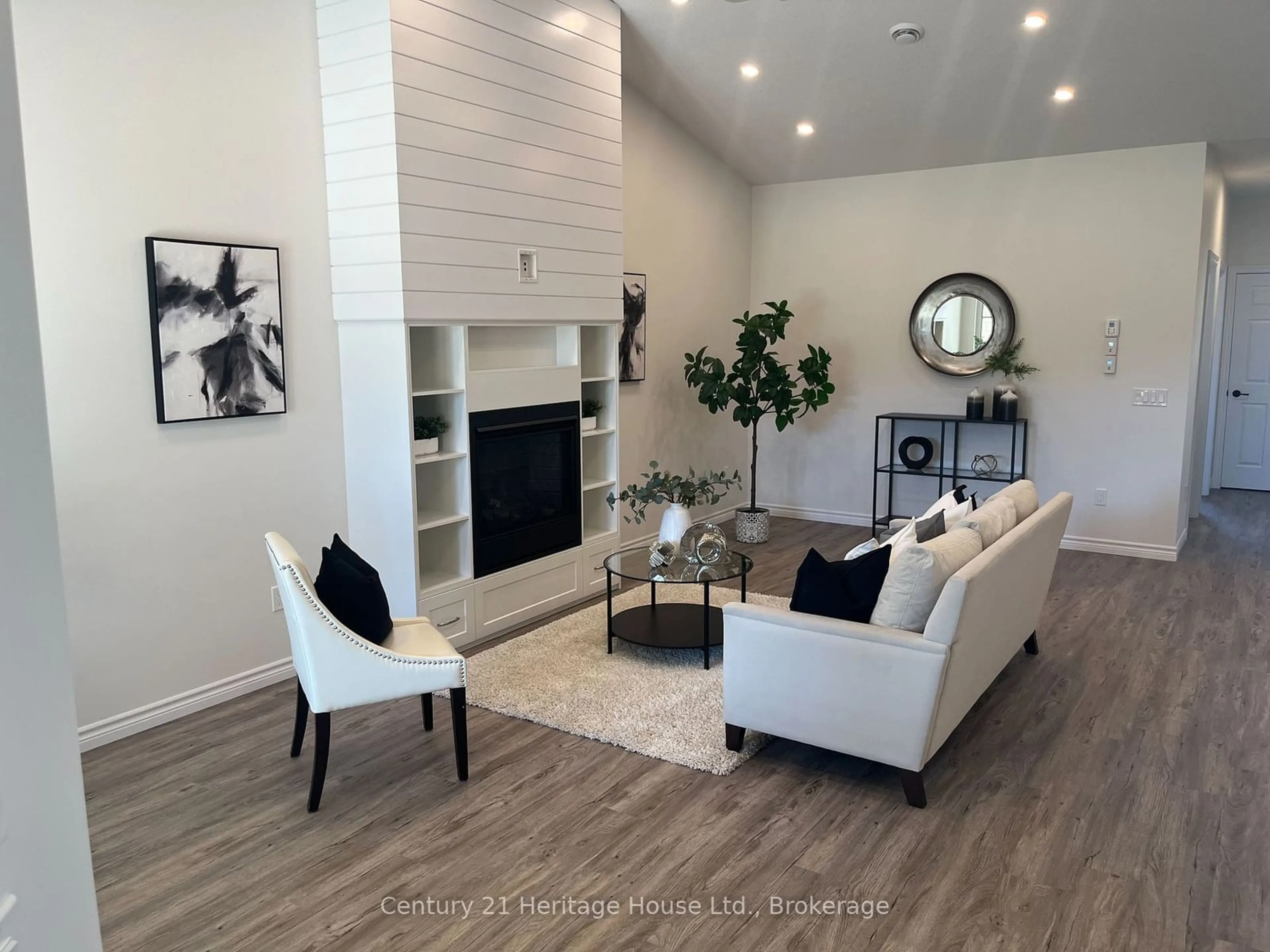 Living room with furniture, wood/laminate floor for 111 Broomer Cres, Wellington North Ontario N0G 2L2