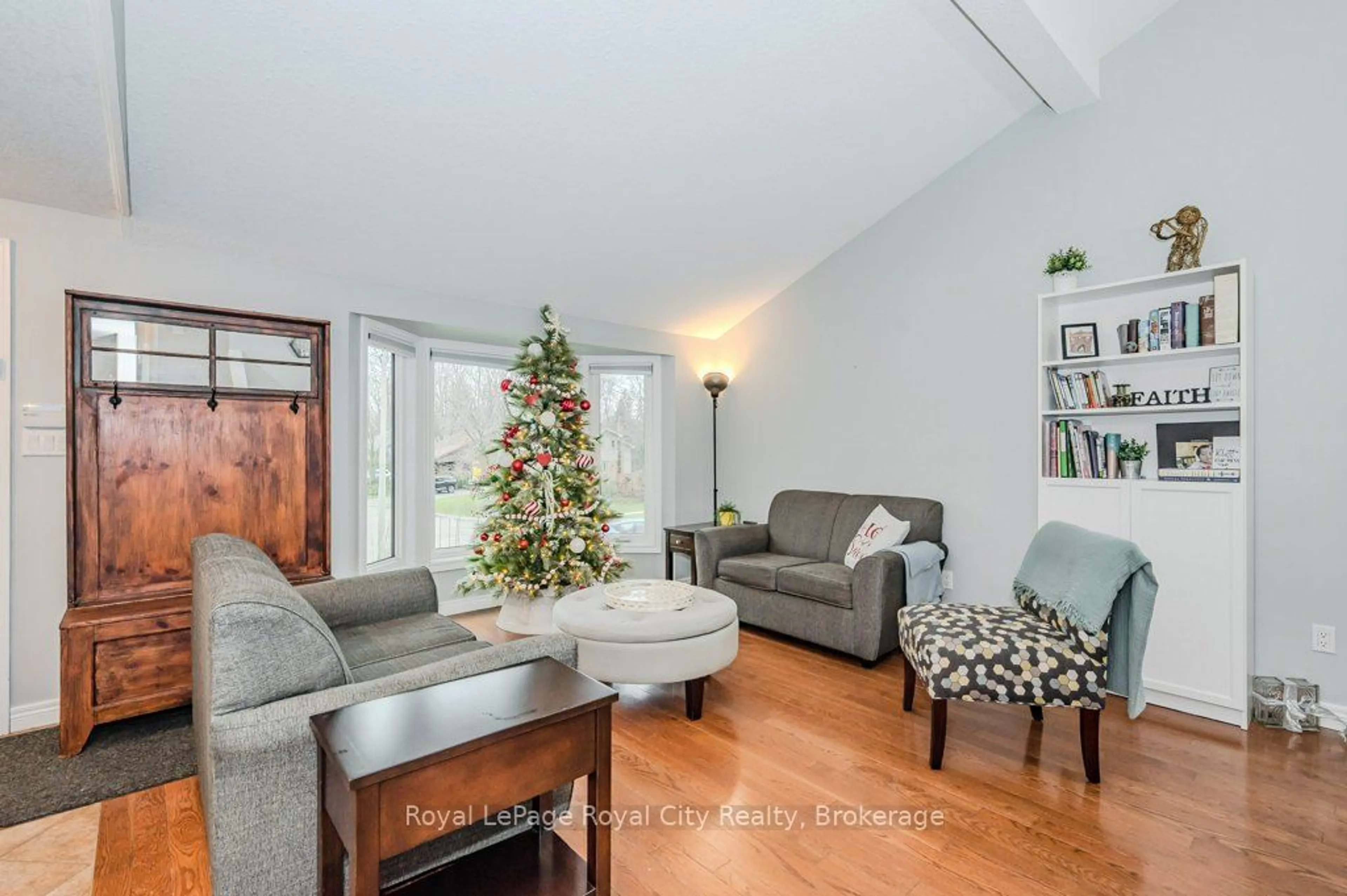 Living room with furniture, wood/laminate floor for 14 Primrose Lane, Guelph Ontario N1H 7V4