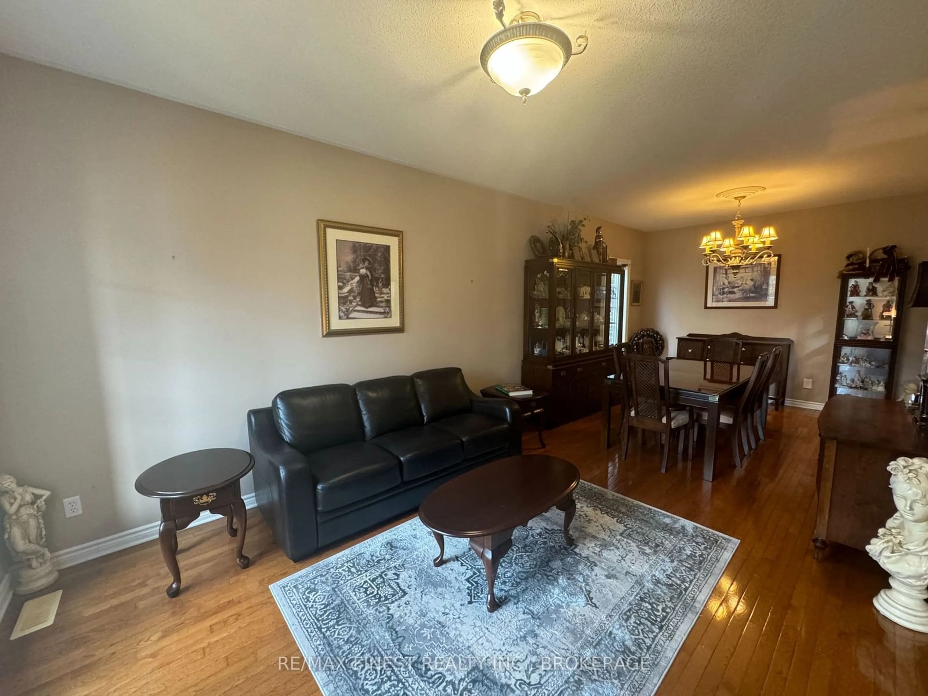 Living room with furniture, wood/laminate floor for 230 HONEYWOOD Ave, Kingston Ontario K7K 7L4